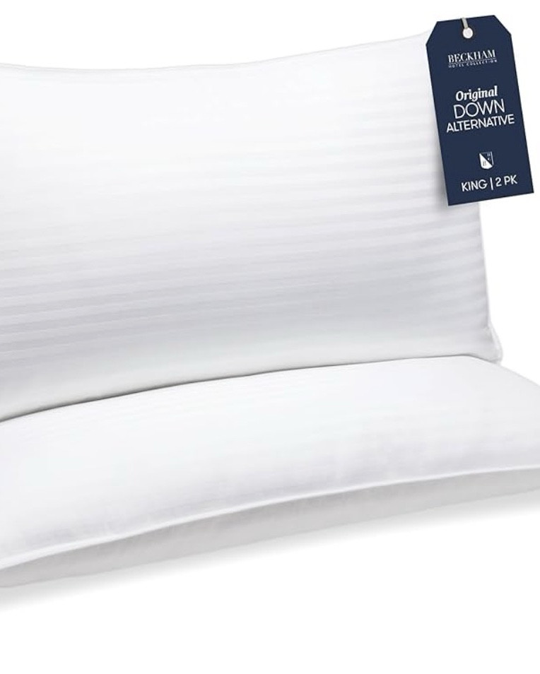 Fill Material Down Alternative
Pillow Type Bed Pillow
Color White
Size King
Brand Beckham Hotel Collection
Shape Rectangular
Cover: 100% Cotton, Fill Material: 100% Polyester Fiber.
SUPERIOR COMFORT - King pillows have a 250 thread count cover filled with a soft down alternative. One of the best new home essentials gift for bedroom, room or home decor.
KEEP COOL - If you easily overheat, or maybe you're looking for cool king size pillows for night sweats, the breathability of our standard bed pillow can offer welcome relief.
SAFE & SOUND - These fluffy Beckham Hotel Collection bed pillows are made in an OEKO-TEX Standard Certified factory that ensures textiles meet high safety and environmental standards.
EASY CLEAN - Unlike memory foam pillows, our pillow for side sleepers is designed to make life as easy as counting sheep! Simply pop them in the washer and tumble dry.
NO SHIFT DESIGN - Whether you're a back, side, or stomach sleeper - our cooling pillows for sleeping can accommodate! The plush bounce-back design of this firm pillow will keep its shape in any position.

#LTKSaleAlert #LTKdayinmylife #LTKU