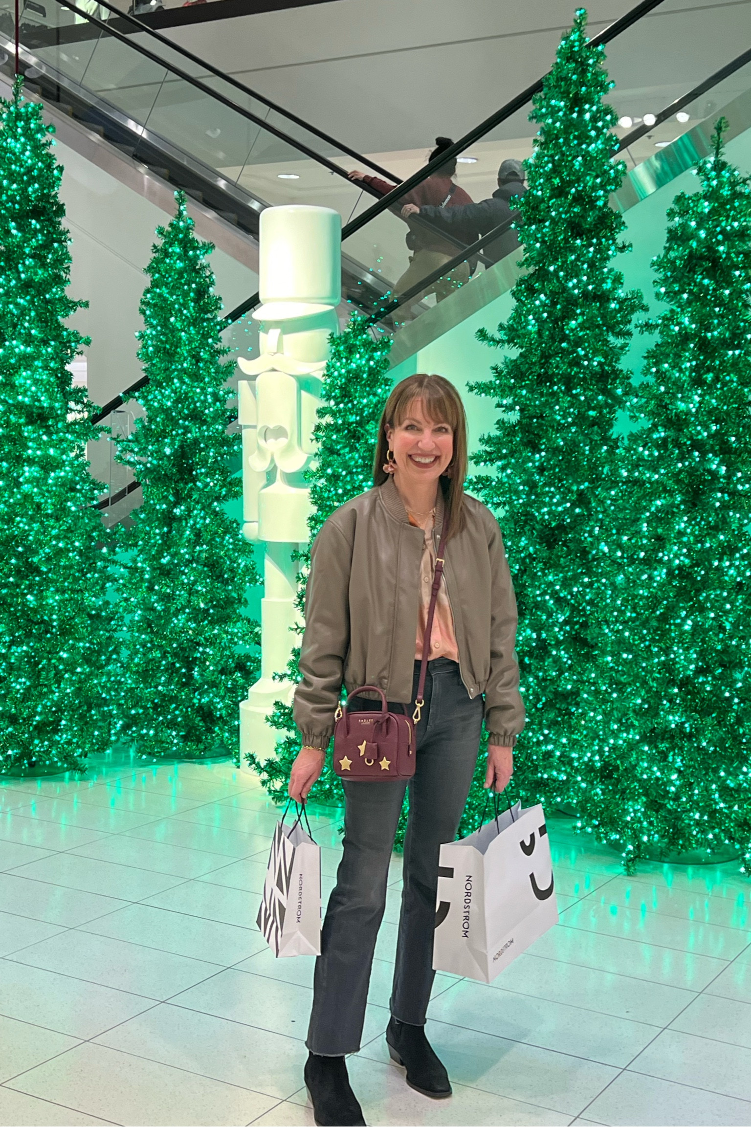 Elevated casual outfit for Christmas shopping! Faux leather bomber from Abercrombie, Sezane blouse, AG jeans, Seychelles boots, Radley London bag

#LTKstyletip #LTKSeasonal #LTKover40