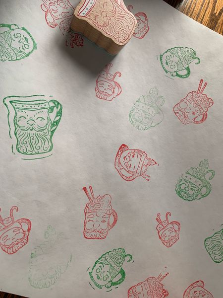 Hand stamped Christmas wrapping paper with vintage inspired Santa stamps. #wrappingpaper #christmas #christmasgift #guftwrap 

#LTKGiftGuide #LTKSeasonal #LTKHoliday