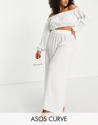 ASOS DESIGN Curve wide leg beach pants in natural gauze | ASOS (Global)