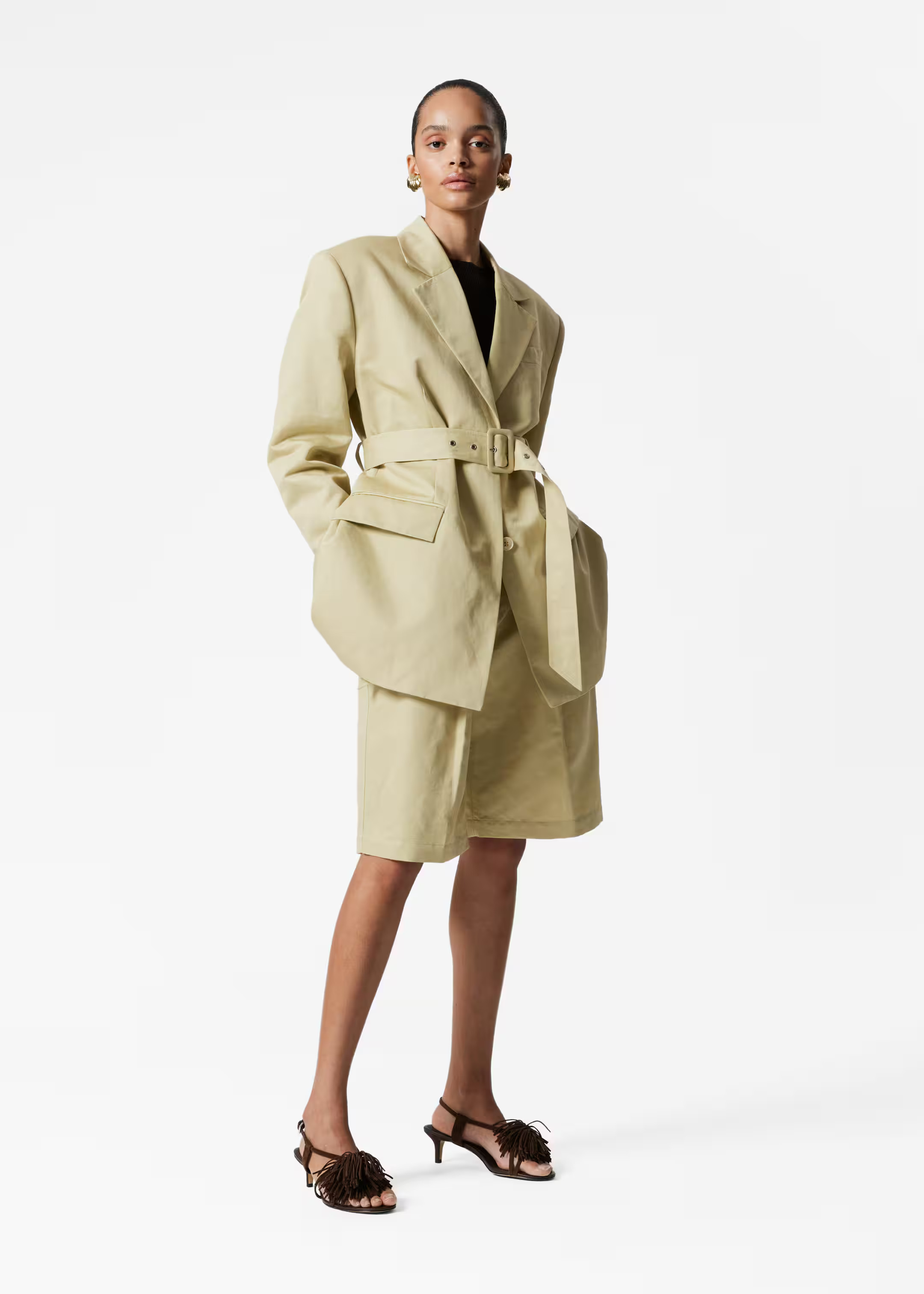 High-waisted Bermuda shorts designed with sharp press-creases, and a wide eyelet belt. Featuring ... | & Other Stories - US