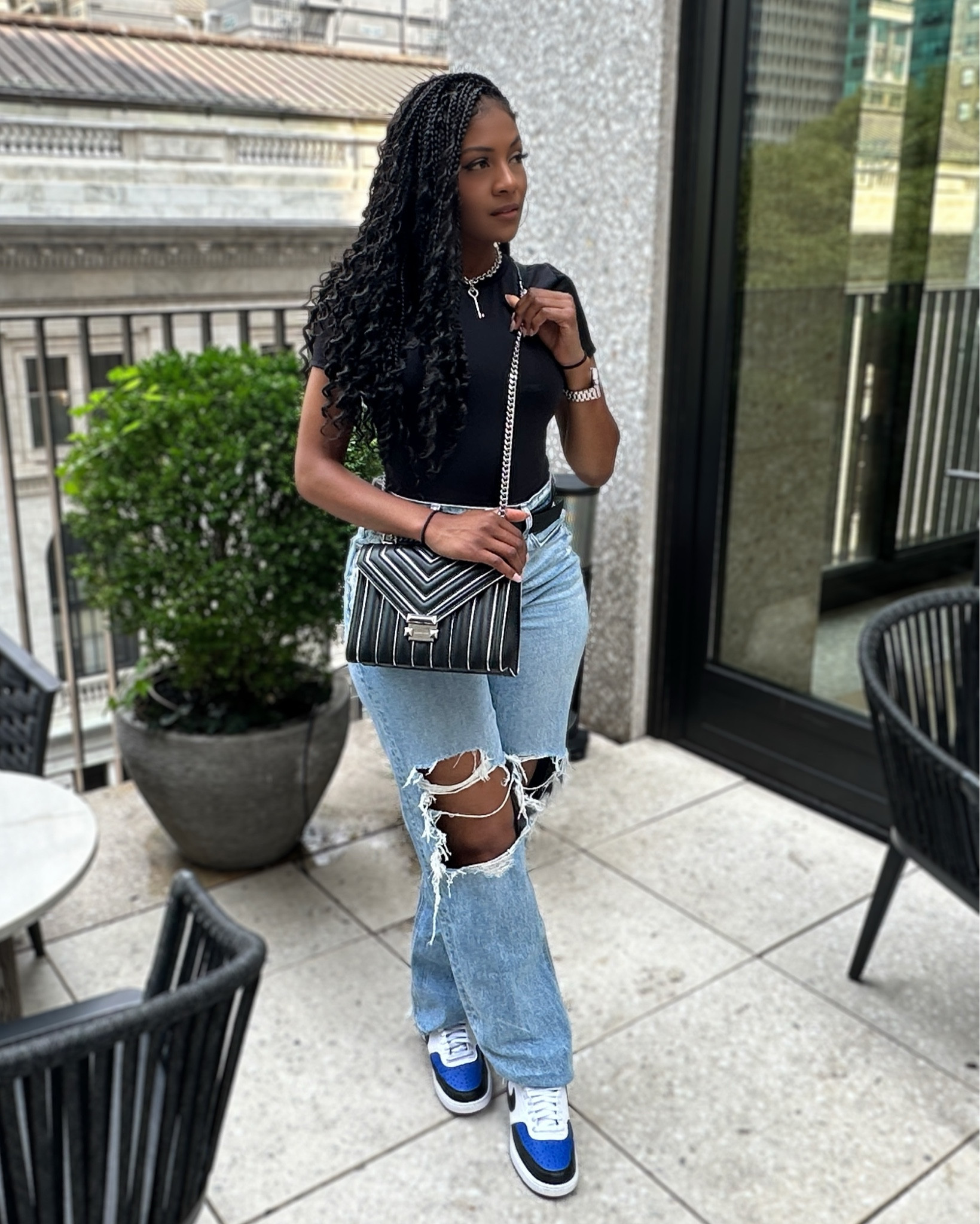 Keeping it casual chic with my go-to ripped wide-leg jeans and a sleek black bodysuit 🙌🏽. Pro tip: pairing high-waisted jeans with a fitted bodysuit gives you that effortlessly put-together look, no matter the occasion! 👖✨ Also loving this pop of metallic on my Michael Kors bag to elevate the whole vibe, and of course, my Nike kicks for that comfy street style. 👟 
#CasualChic #LTKfashion

#LTKFindsUnder100