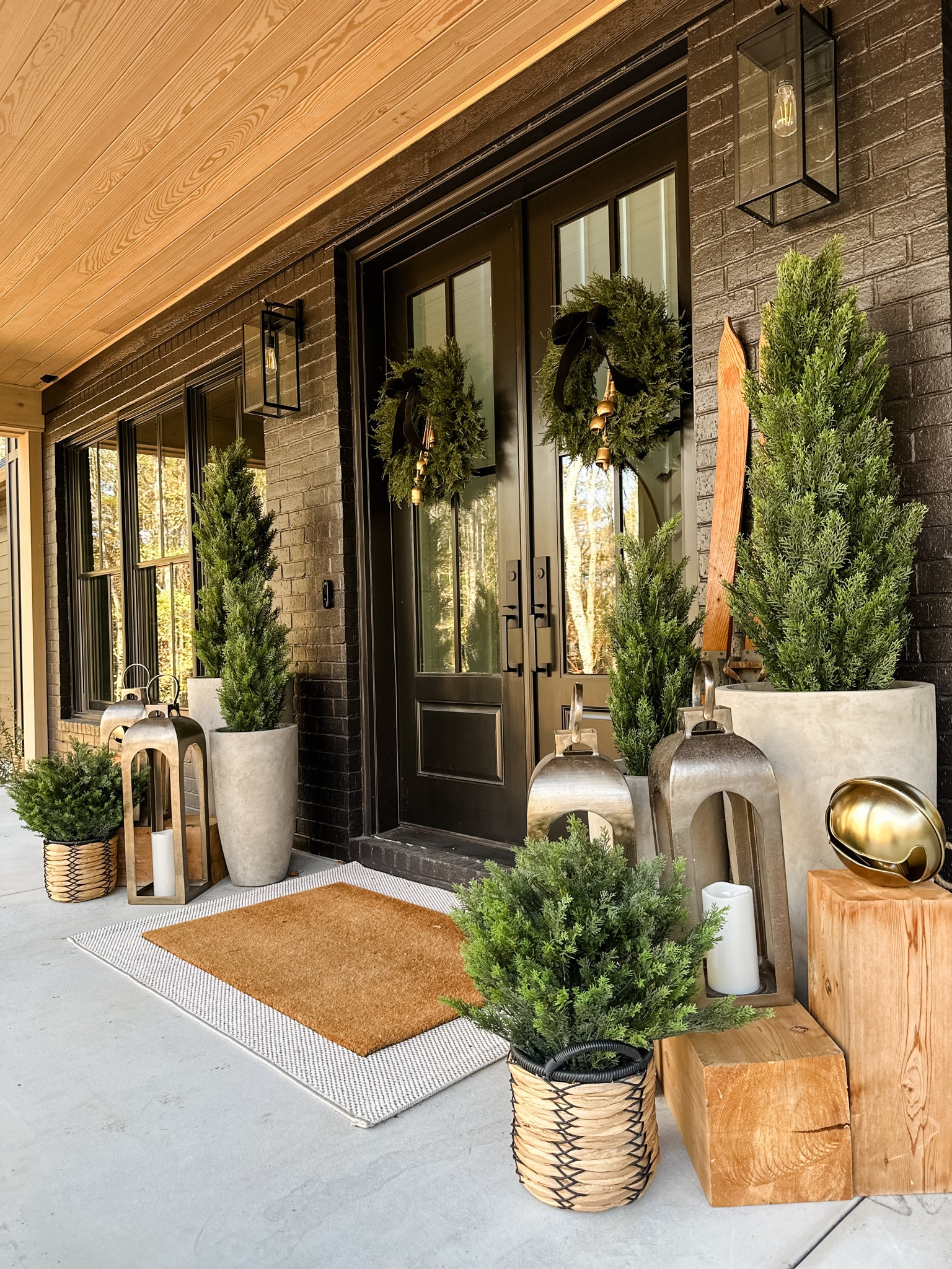 Winter front porch decor.  Faux cedar trees are the perfect and fool proof addition. 

#LTKSeasonal #LTKhome #LTKHoliday