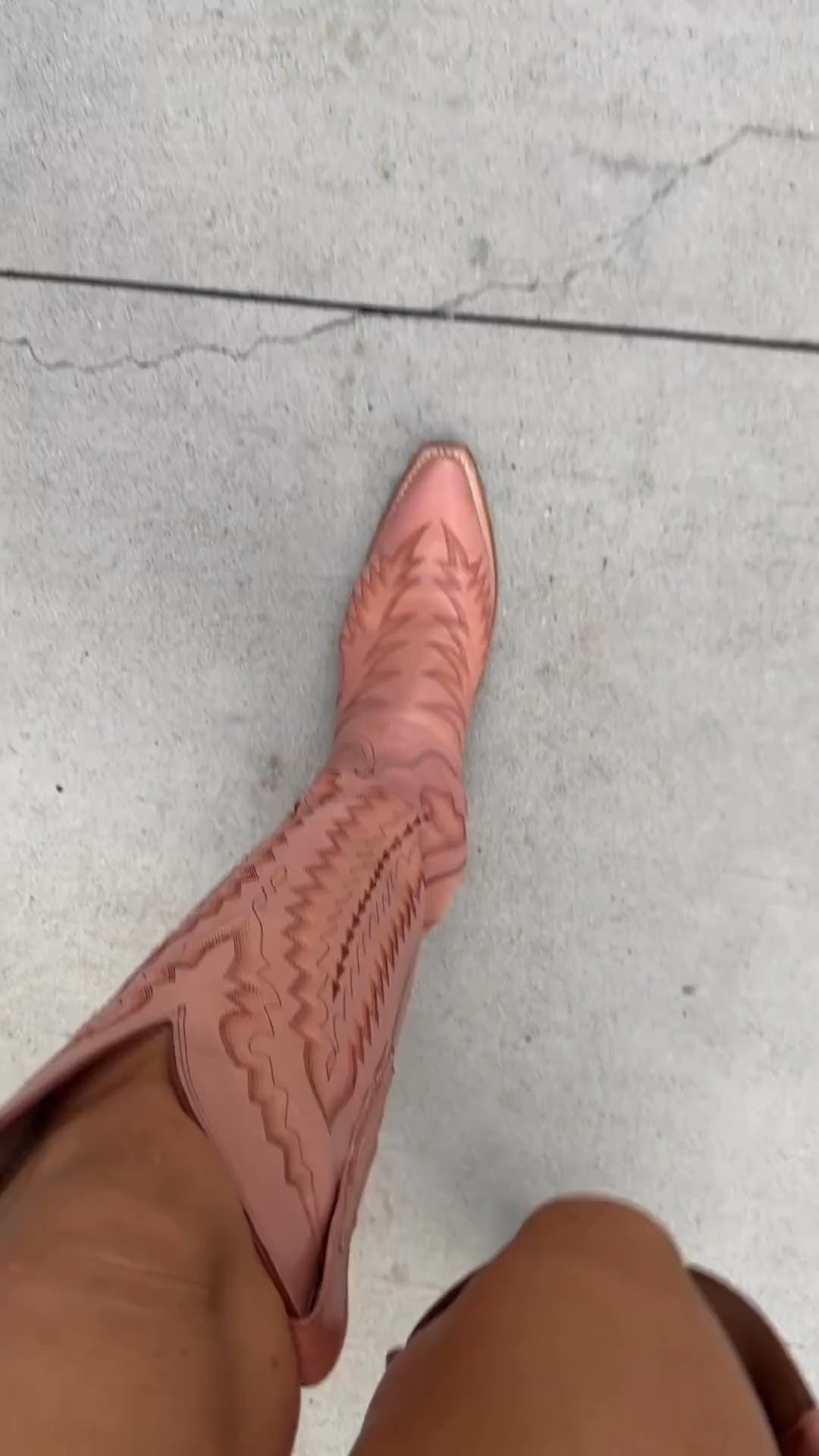 Pink cowboy boots, country concert outfit