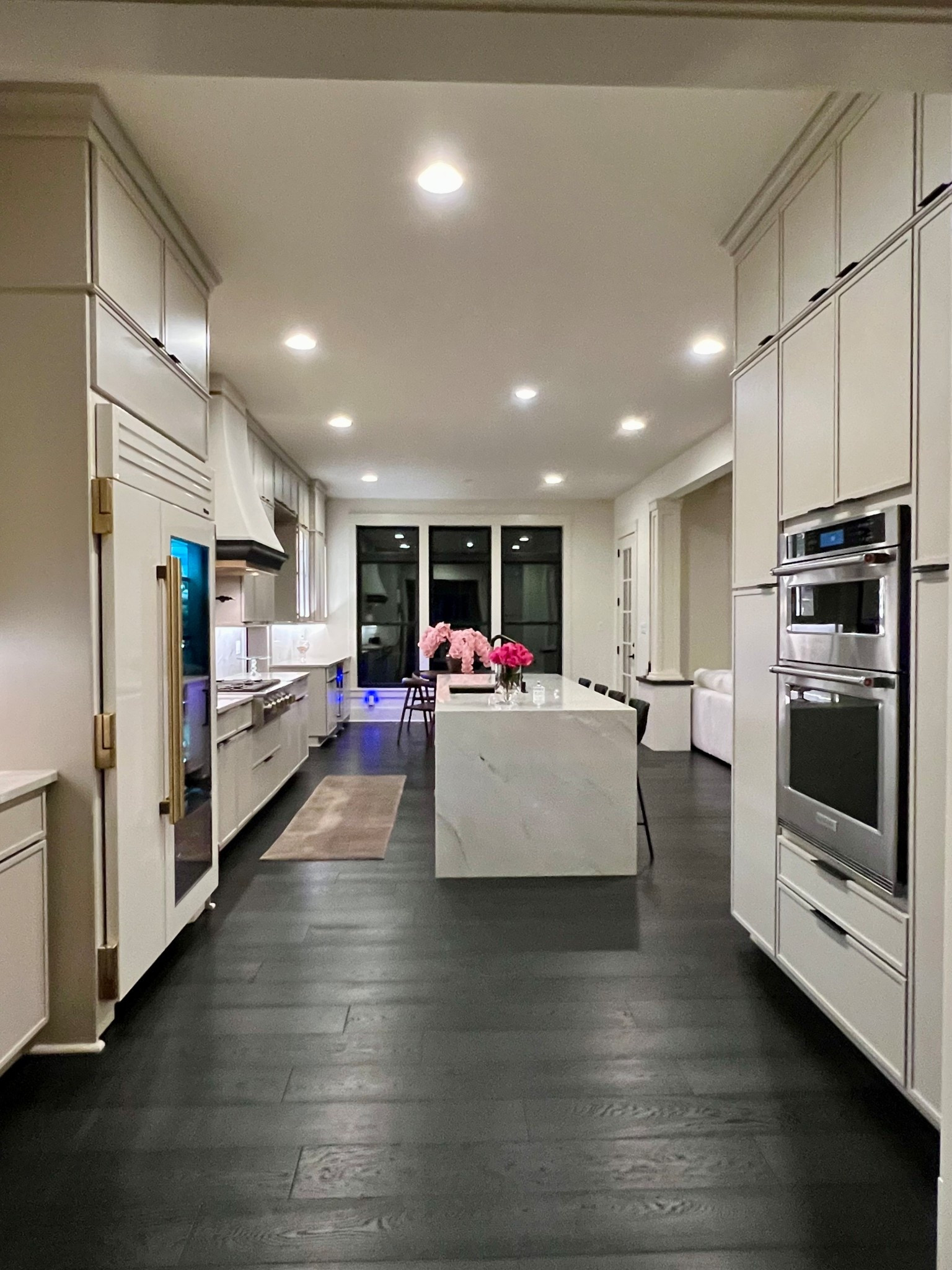 Dark hardwood floors and light colored walls can make ceilings look higher.

#LTKStyleTip