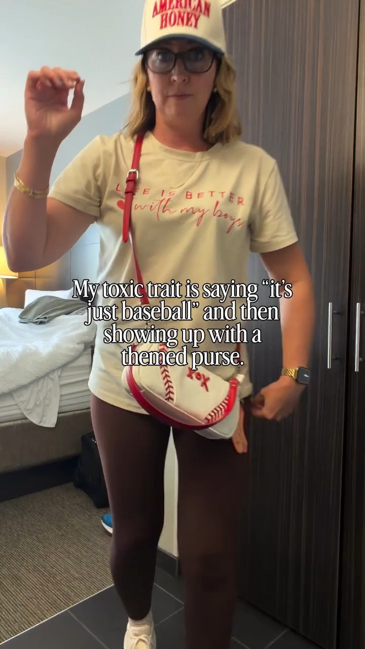 Baseball trip math: one cute fit, one American Honey hat, one Betsey Johnson baseball purse, and absolutely no apologies for making the folding chair feel like a moment. ⚾️🤍

It’s not doing too much… it’s called being prepared.

#baseballmom #collegeworldseries #americanhoney #styleinspo #styleover40