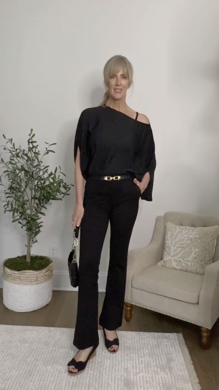 A date night look that is comfy for the woman over 40 who doesn’t want to suffer for fashion. 

The bat wing, slit-sleeve top is lightweight and sophisticated.   Paired with a straight line trouser pant and wedge heel.  

Wearing size small in top, size 6 (S) in pants.  My shoes are several years old but I’ve tagged the current version.  

#LTKStyleTip #LTKOver40 #LTKVideo