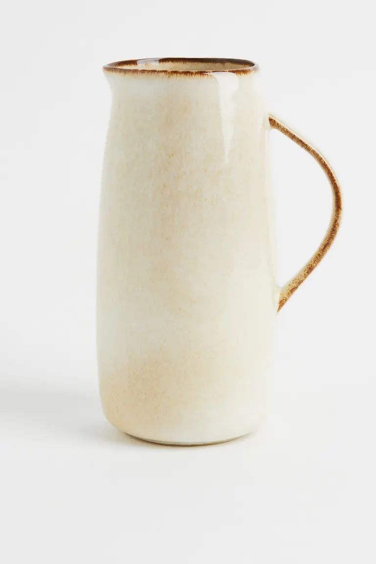 Pitcher in glazed stoneware with a handle and spout. Diameter 5 in. Height 8 3/4 in. Reactive gla... | H&M (US + CA)