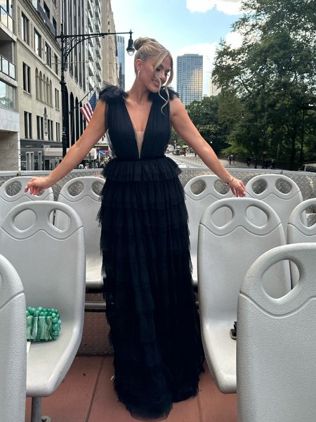 Black tie formal gown with statement detailing, tulle tiered layers, and low v neckline perfect for a gala or wedding guest dress. Is a special event splurge 

#LTKwedding #LTKparties #LTKstyletip