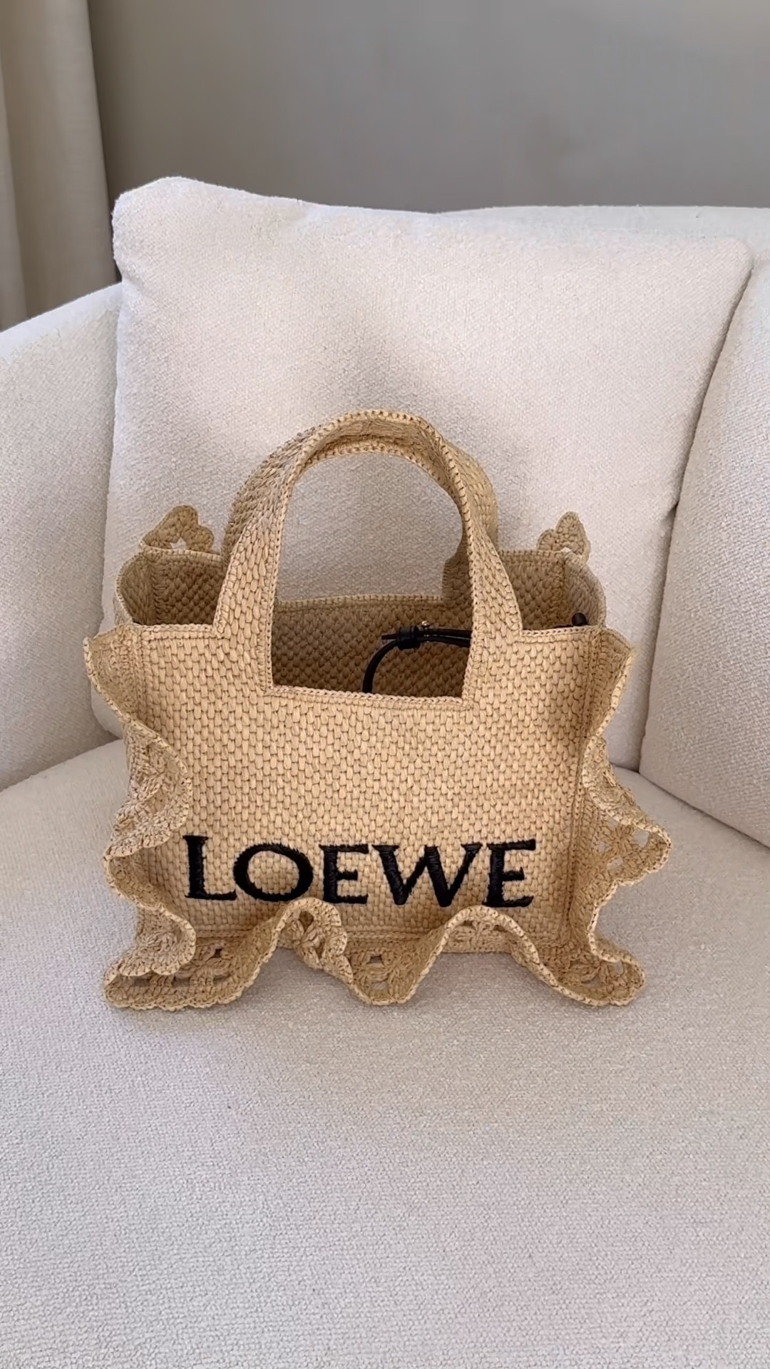 My new summer bag 🥹🐚
Story time 📖 I’ve been wanting the Loewe Ibiza for SO LONG so I was going to treat myself for Mother’s Day BUT when I walked in, this new 2025 beauty was on the table and I DIED 😍 immediately grabbed it and the rest is history ❤️ can’t wait to carry her around all summer ✨ comes with an adjustable and removable black leather crossbody strap.

#loewe #loewebag #summerbag #strawbag #raffiabag #Small Natural Raffia Ruffle Logo Tote #beachbag #designerbag 

#LTKStyleTip #LTKSeasonal #LTKItBag