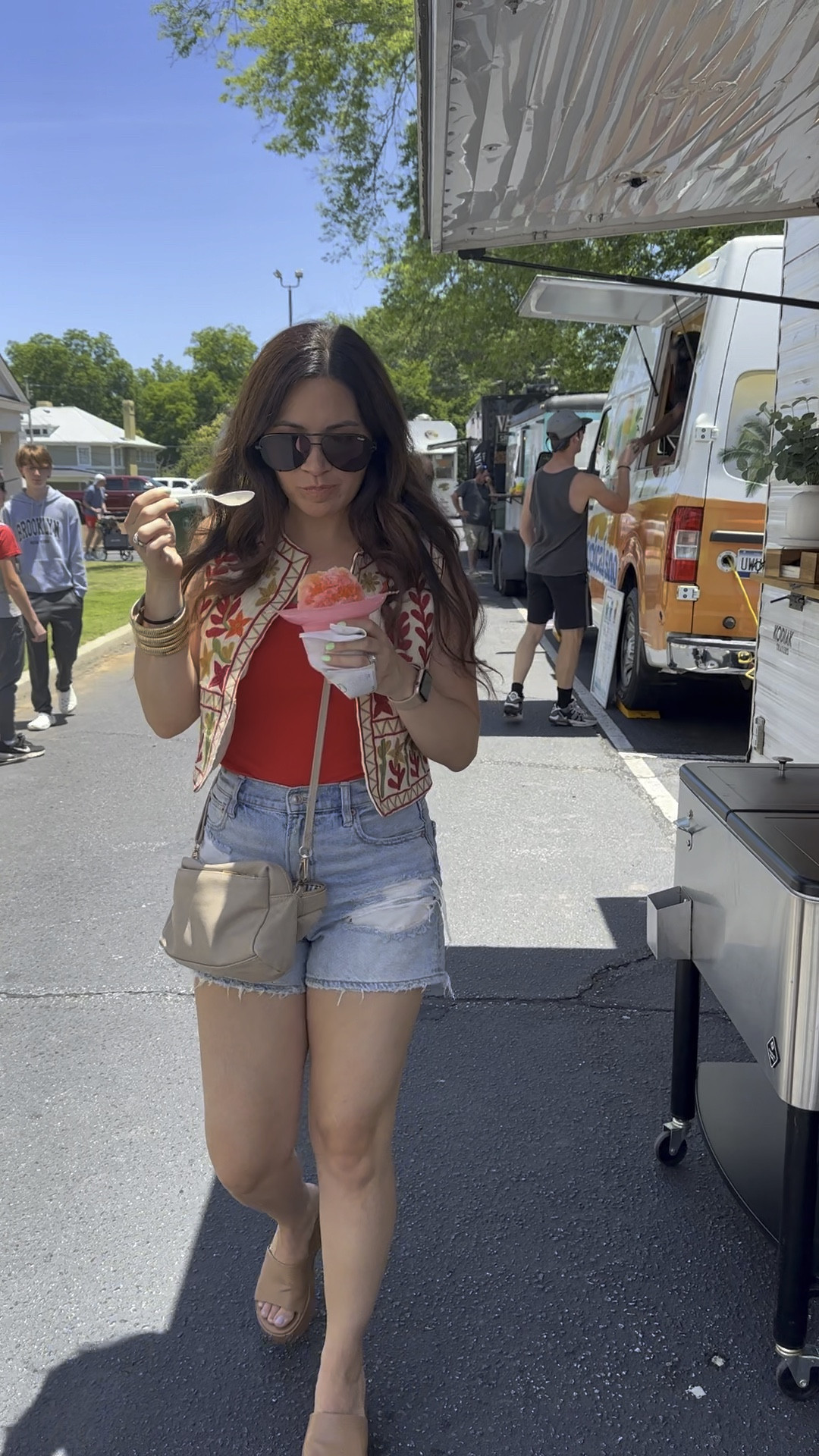 Embroidered vest 
Red bodysuit 
American eagle jean shorts 
Sunglasses 
Cognac sandals 

Goodnight macaroon target Amazon quay summer outfit 