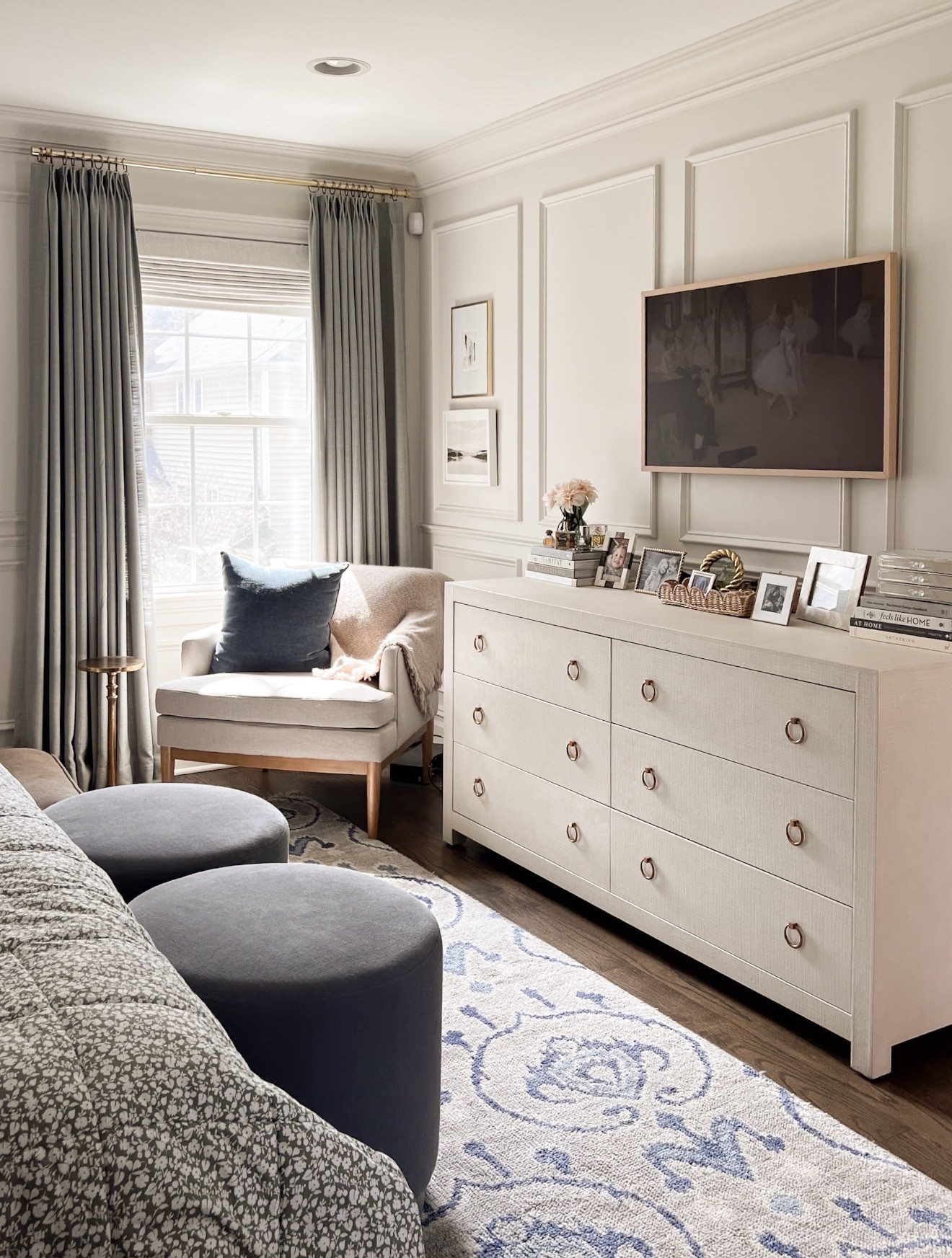 This corner of our bedroom is one of my favorite spots to relax. The paneled wall detail and soft neutral furniture keep the space elegant while the navy pillow adds a subtle coastal accent. Natural light helps highlight the warm paint tones and layered textures.

bedroom sitting area, paneled wall molding, neutral bedroom corner, navy accent pillow decor, cozy bedroom seating, modern traditional bedroom, layered neutral interiors, bedroom reading nook, warm neutral paint colors, coastal bedroom styling, elegant bedroom decor, girlonthehudson

#LTKHome
