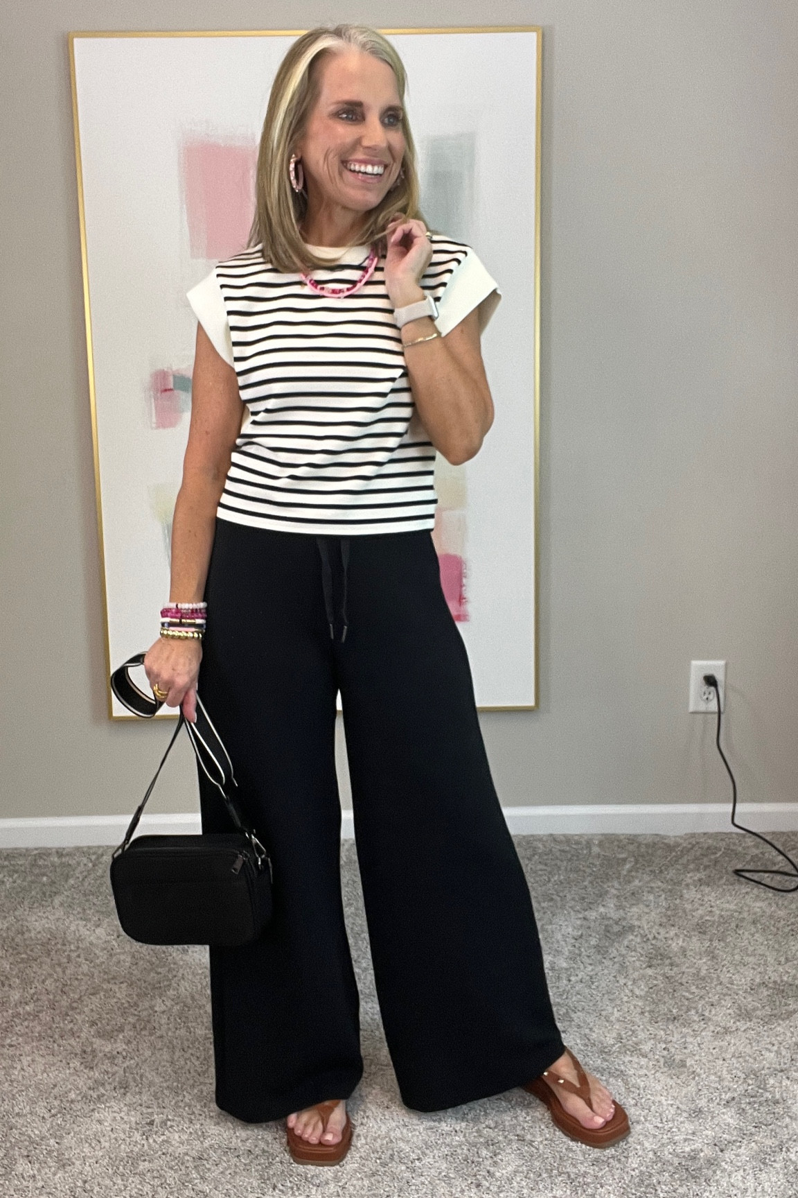Pulled this top and it’s everything I wanted. Wearing small. 
Wearing PM pants 
Perfect travel look 
Use LISAXSPANX on both 
Use COAST on sandals 

#LTKtravel #LTKstyletip #LTKover40