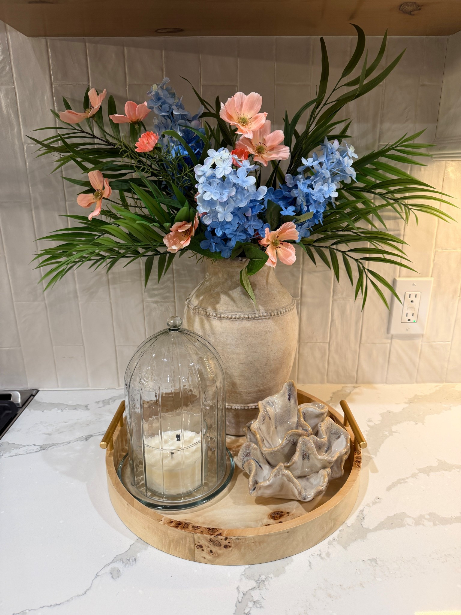 Target has some great stems for $5! I went for a beachy spring vibe. I’d rec 4 of the green eucalyptus stems. I already had two palms leaf stems so I just did 2. I have 3 hydrangeas and 2 of the peach flowers. This vase is old but I did link some options. 

#LTKHome