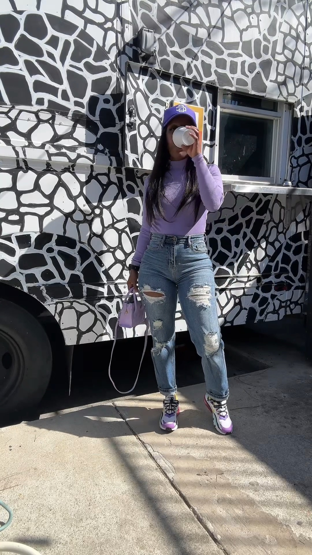 Coffee shop outfit of the day. I’m wearing a purple mock neck long sleeve bodysuit, high waisted distressed jeans, purple trucker hat, purple purse, and air max react 270 sneakers

#LTKootd #LTKFindsUnder50 #LTKOver40