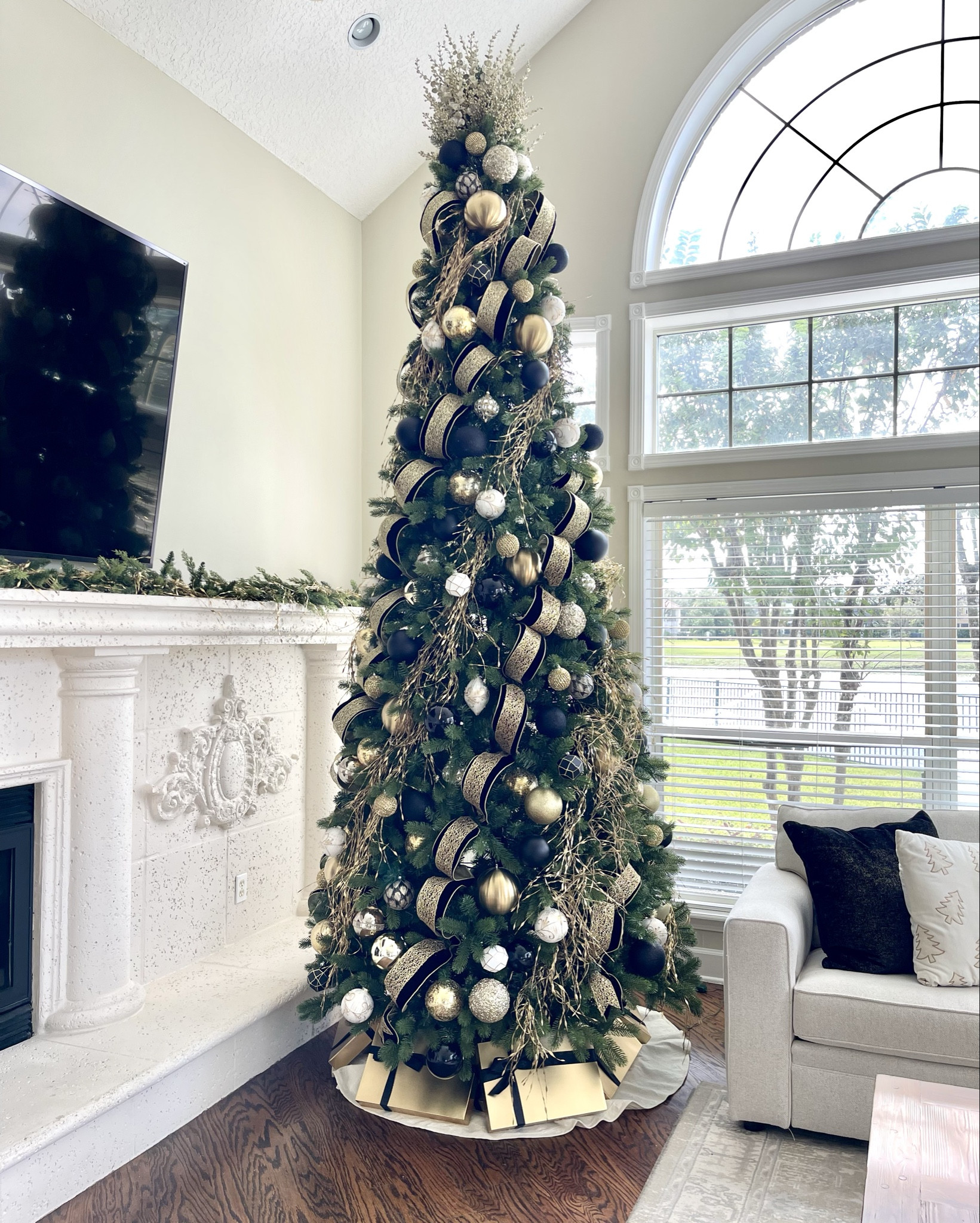 Last year, my client upgraded from a 10’ tree to a 12’, and it was absolutely worth it! I still remember the original tree that inspired the design—it was in my office when she messaged me about it. Now, four years later, I’m still decorating for them, and they’ve expanded to three trees!
.
.
.
.
#christmastree #christmastreedesign #blackandgoldchristmas #blackribbon #velvetribbon #christmasinspo #christmasinspiration #christmasdecorating #12foottree #tallceilings #christmasmood #holdmyeggnog 

#LTKHome #LTKFamily #LTKSeasonal