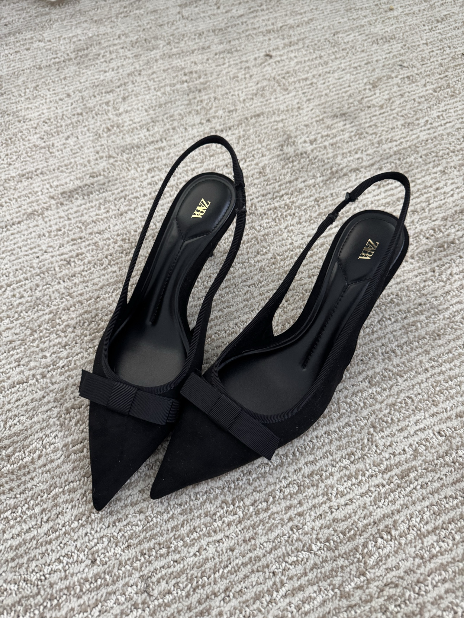 Suede bow heels, perfect for the holidays! It’s a suede material with a fabric bow and some nice cushion on the bottom. It’s a sling back and it has a 1 inch heel. I got my normal size and the heels are under $60.