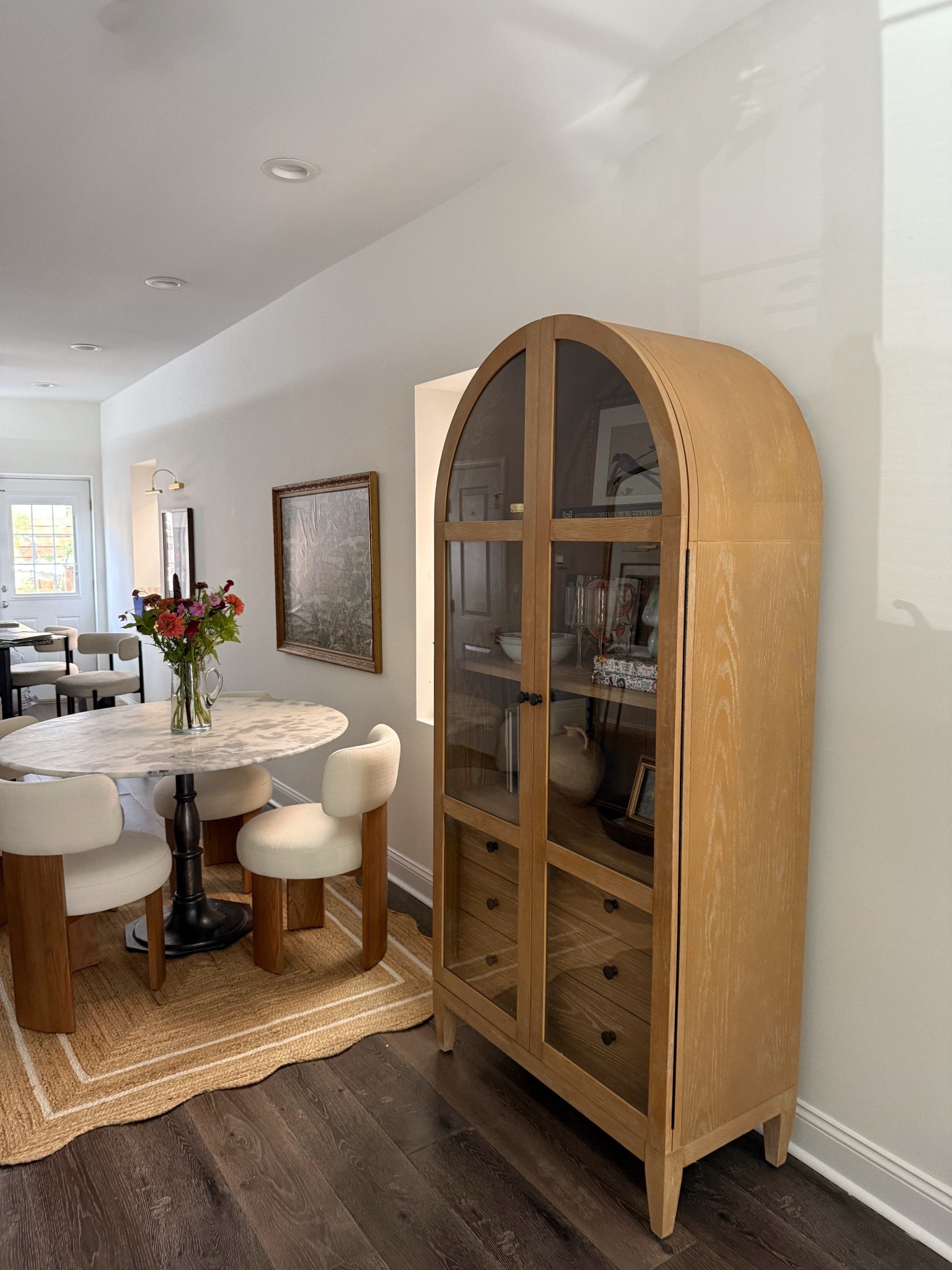 Love my cozy home!! Coming along day by day :) this arched cabinet has been such a game changer in terms of storage. Also finally got a dining table and chairs from Lulu & Georgia! They are great for small spaces as the chairs completely under the table. 

#LTKSeasonal #LTKStyleTip #LTKHome