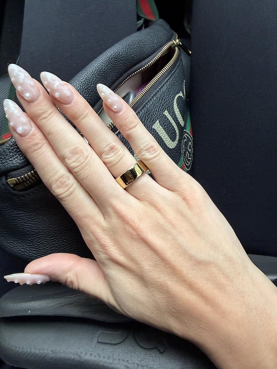 Obsessed with this simple gold band paired with these beautiful almond-shaped pearl accent nails and my Gucci belt bag. #LTKJewelry #PearlNails #RingStack 

 #LTKHoliday #LTKdayinmylife #LTKootd