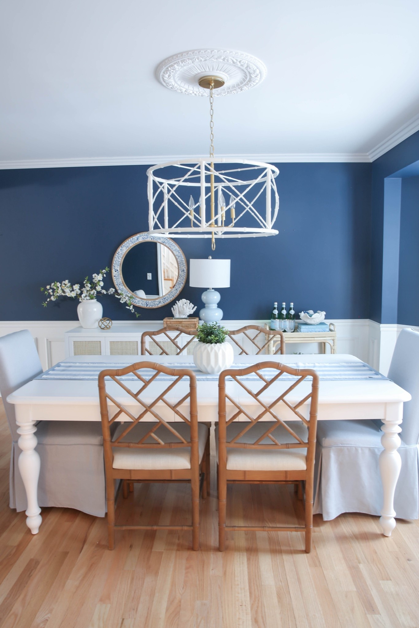 My coastal dining room features a white dining table, blue dining chairs, and blue and white accent pieces for a classic modern coastal look. I love how the crisp white furniture paired with layered blue and white decor makes this space feel bright, airy, and designer-inspired.



#LTKHome #LTKU #LTKSaleAlert