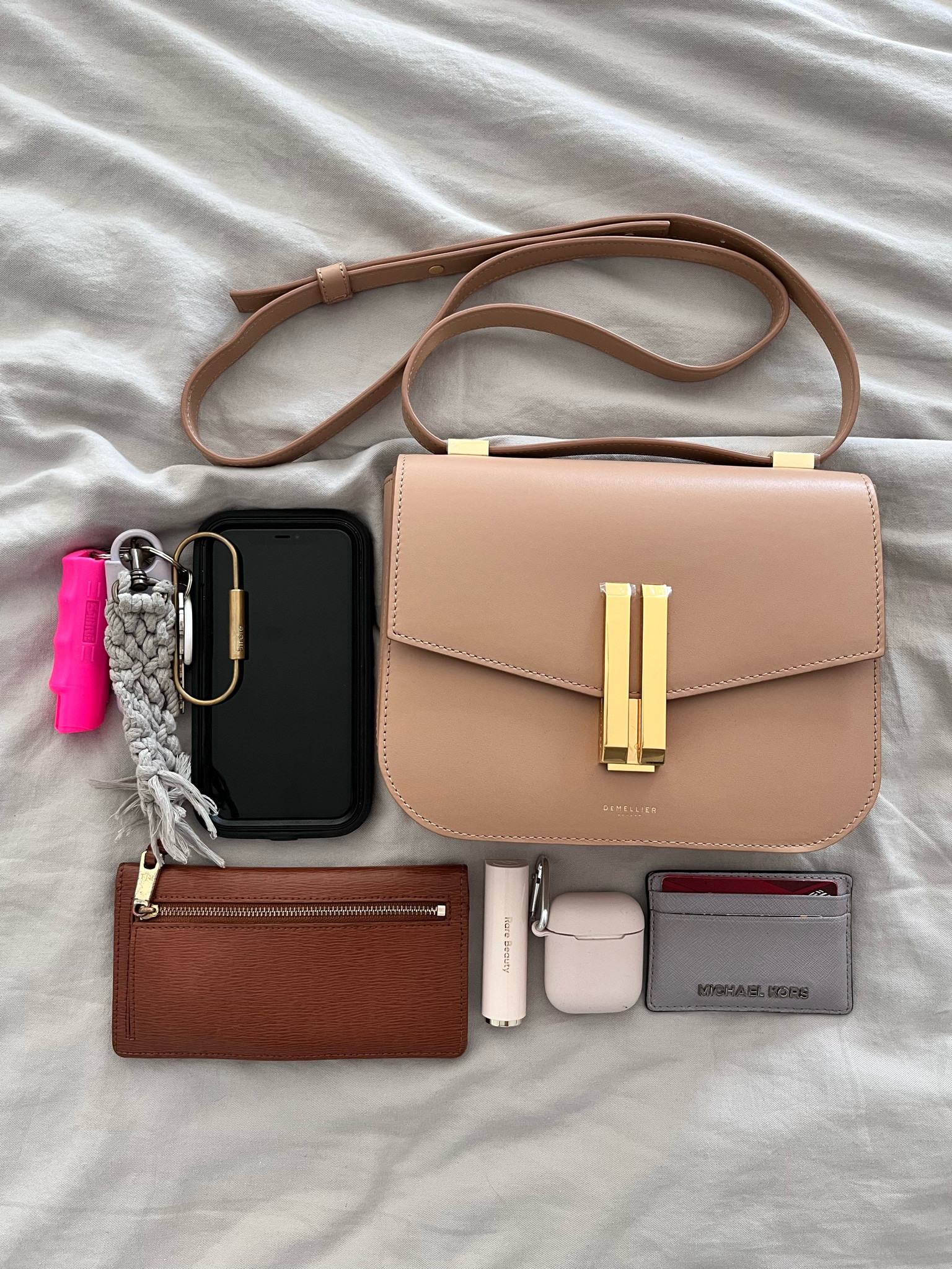 What Fits Inside my Demellier Vancouver Crossbody Bag: color here is the light tan smooth. Also linked similar neutral bags ON SALE this week.

Functional and stylish crossbody with adjustable straps, gold hardware. You can also wear the bag as a shoulder bag with double strap configuration. 

#LTKstyletip #LTKitbag #LTKworkwear