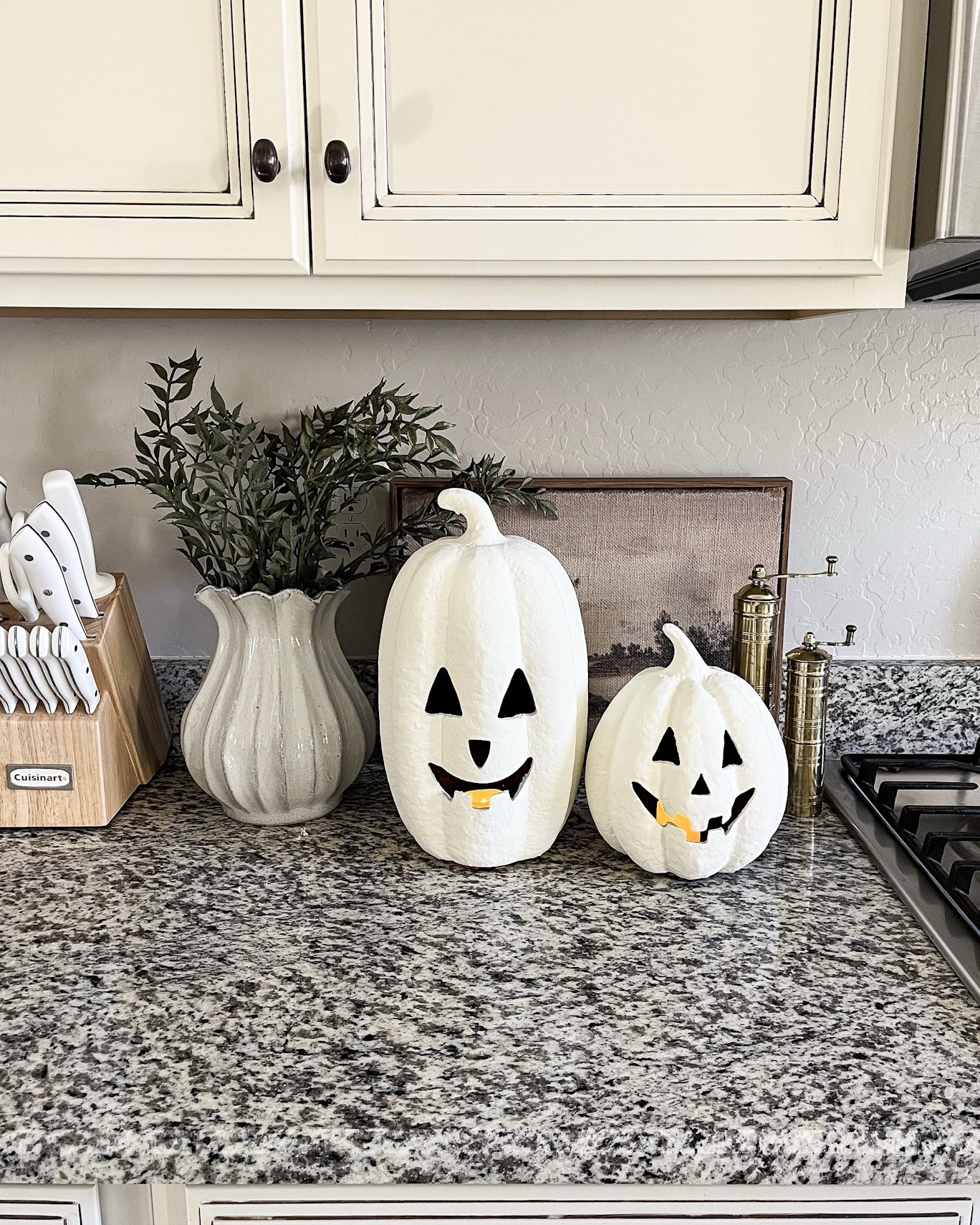 White jack o lanterns! Follow @lifeinmyarizonahome on Instagram for more inspiration.

These Jack o Lanterns have the look of the more expensive Terracotta ones but are light weight and a fraction of the cost.
They can also fit a votive flameless candle for that cozy nighttime glow!

#halloweendecor #homedecor

#LTKFindsUnder50 #LTKHome #LTKSeasonal