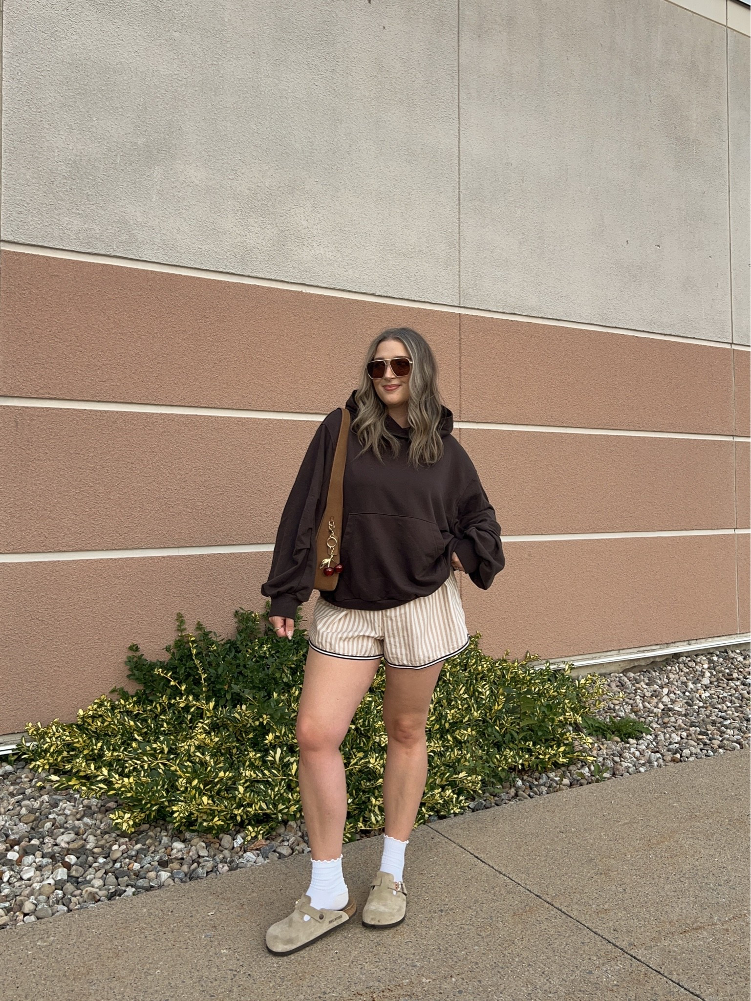 Comfy early fall outfit! Wearing M in the chocolate brown hoodie. Wearing L in the striped boxer shorts but should have done M (exact Canadian shorts link under “similar products”). I’m a 9.5-10 shoe and wear a 40 in the Birkenstock clogs

#LTKfall #LTKsale #LTKmidsize