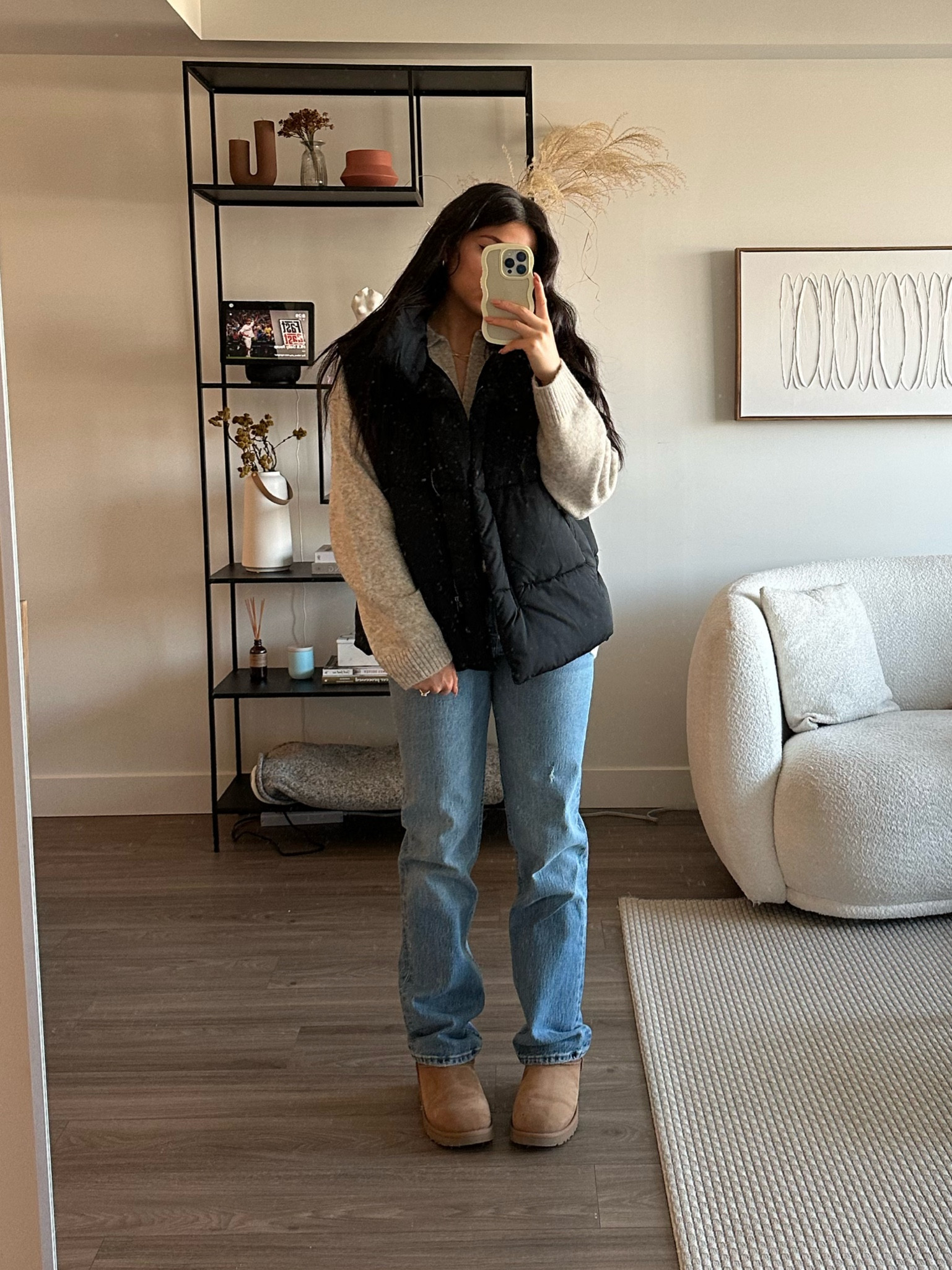 Puffer vest: urban outfitters 
Sweater: H&M
Jeans: Abercrombie 
Boots: Uggs 