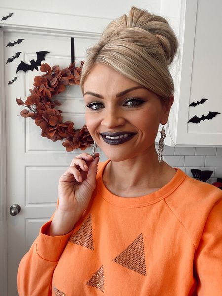 Cutest Halloween earrings, Chaser brand Pumpkin sweatshirt from Zappos, along with my Spooky lip combo! 👻

#LTKunder50 #LTKbeauty #LTKHalloween