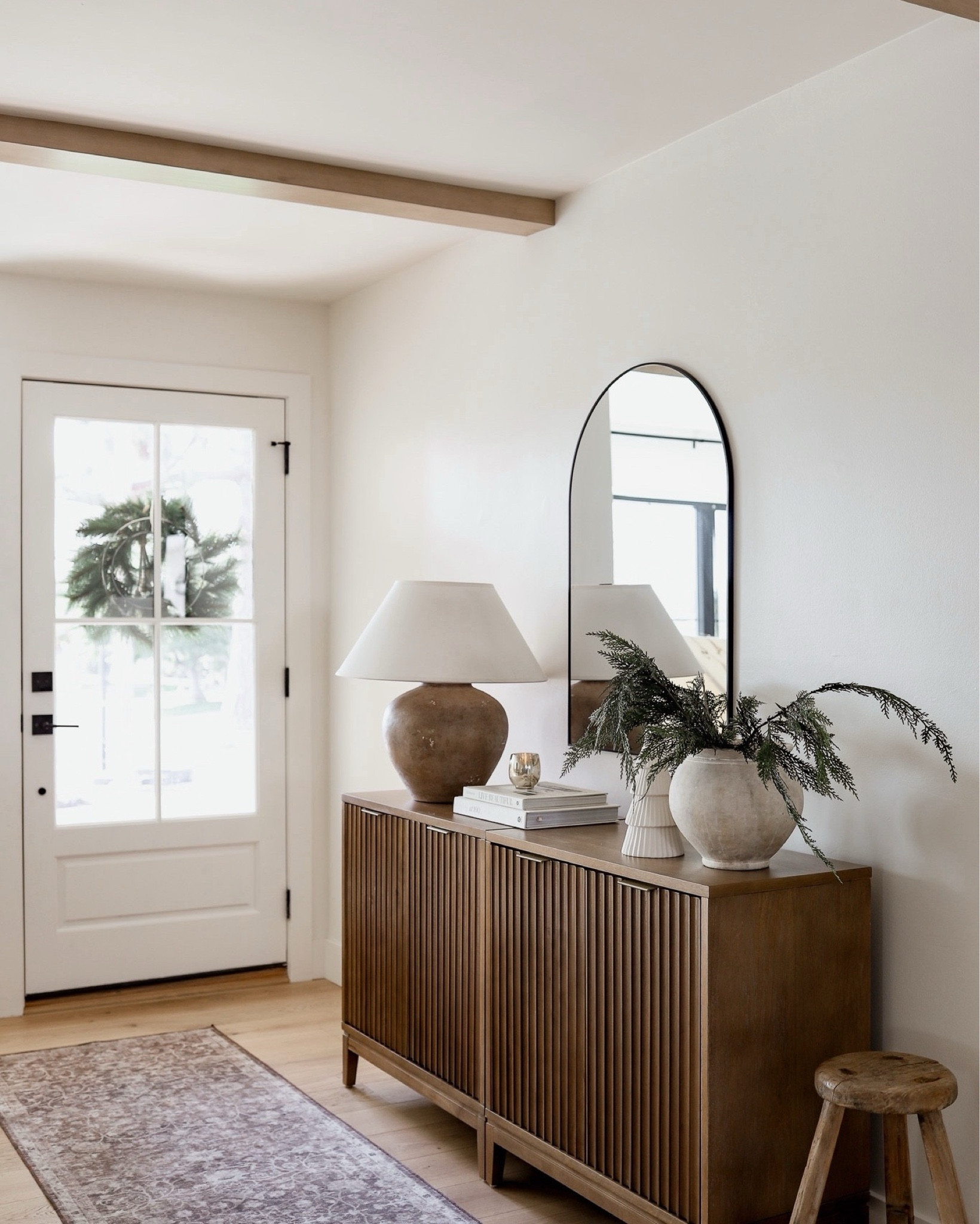 Winter entryway inspo! Shop this gorgeous cabinet and decor. The cabinet is in the ‘light brown’ color! 

#lamp #rug #mirror #styling #organic 

#LTKFindsUnder100 #LTKHome #LTKSaleAlert