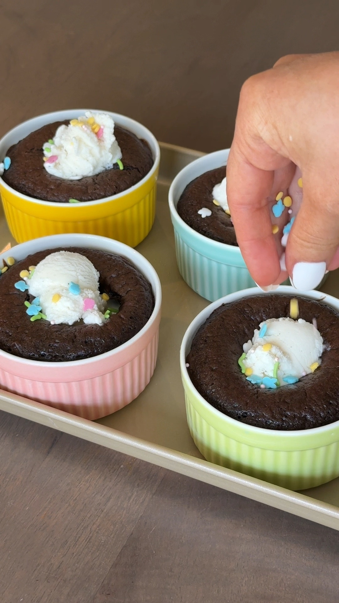 Mini caramel chocolate molten cakes

DIRECTIONS
1. Make the chocolate cake according to directions. Pour cake batter halfway into souffle ramekin dishes. 
2. Place an unwrapped cadbury egg on top of the batter in each dish. Cover with the remaining cake batter until hidden
3. Place in oven at 350 degrees for 15-18 minutes.
4. Serve warm - optional: with ice cream and sprinkles!


Easter ideas, dessert idea, kitchen, cooking, baking

#LTKHome #LTKSeasonal #LTKParties