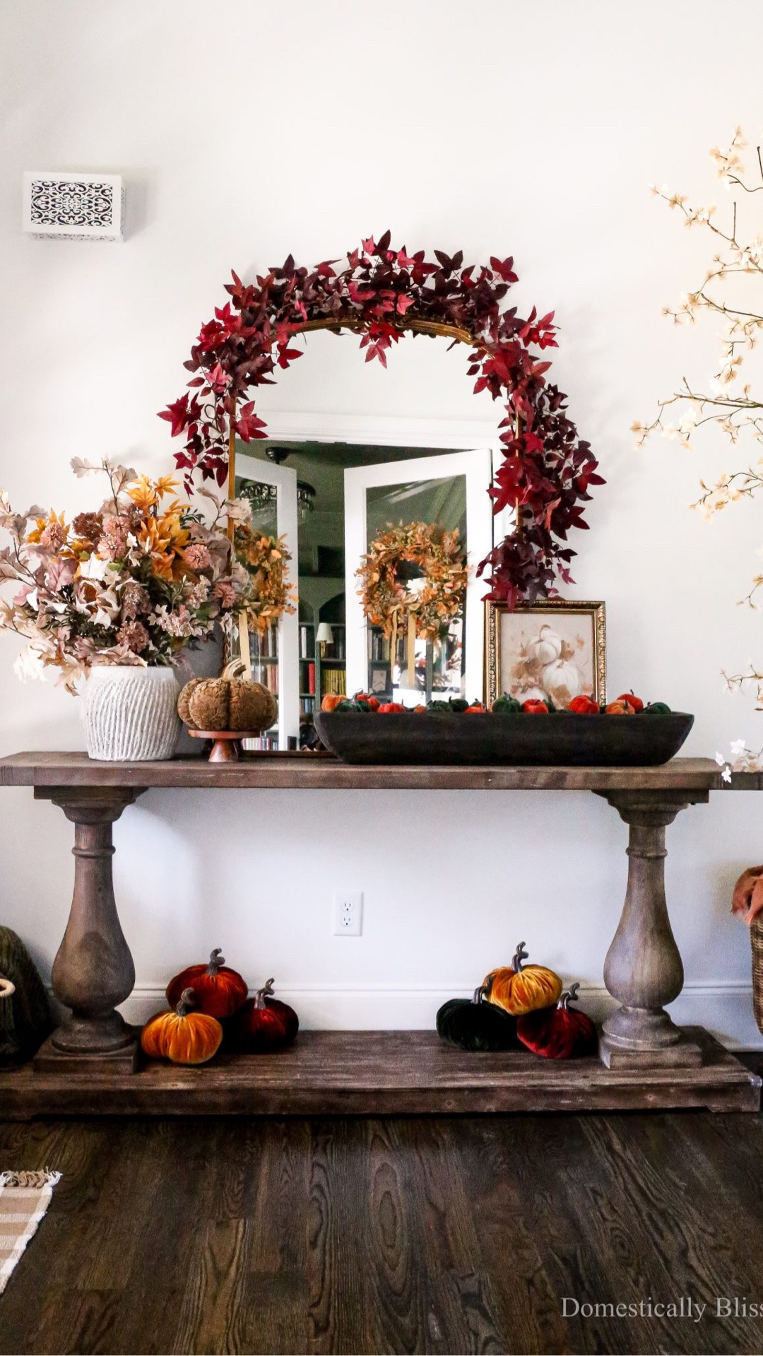 Moody Fall Entryway Decor with fall stems & garlands, a DIY fall maple tree, big & small pumpkins, and cozy fall colors.

#LTKSeasonal #LTKHome #LTKmomlife