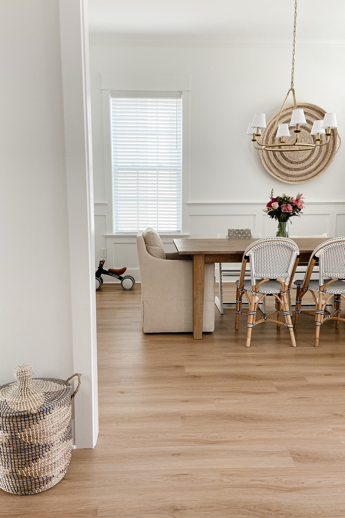 Clean dining room views (and yes we have bikes in the house 🙃)
#kidfriendlyhome #kidfriendlydecor #diningroom #diningtable #diningchairs #lightandairy #kidfriendlydesign #diningroomdecor #storagebaskets 

#LTKHome