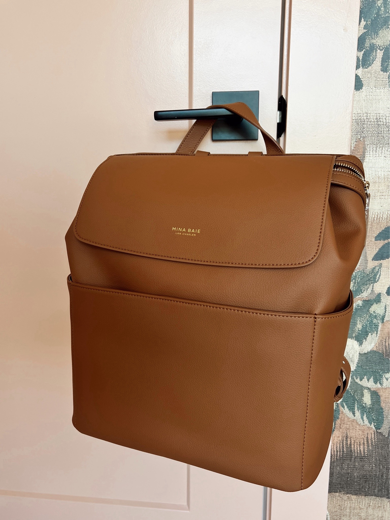 Diaper bag made of vegan leather that’s a little more elevated than the typical backpack! Love how this fits a laptop, too! 


#LTKBaby #LTKStyleTip #LTKItBag