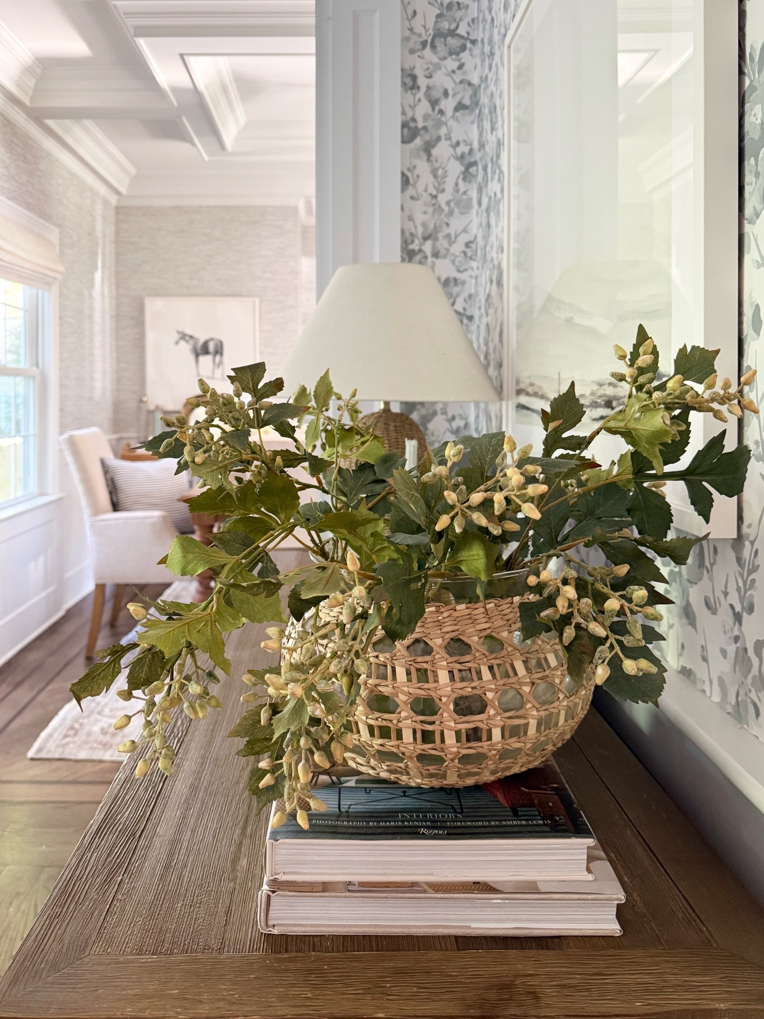 I love how a simple arrangement of faux greenery can bring so much life to a space. These leafy stems paired with the woven vase add beautiful texture and a natural, collected feel to this console table. Such an easy way to style a corner year-round!

faux greenery, artificial floral stems, woven vase, rattan vase, console table decor, greenery arrangement, entryway styling, natural home decor, decorative branches, modern coastal home, neutral home accents, girlonthehudson