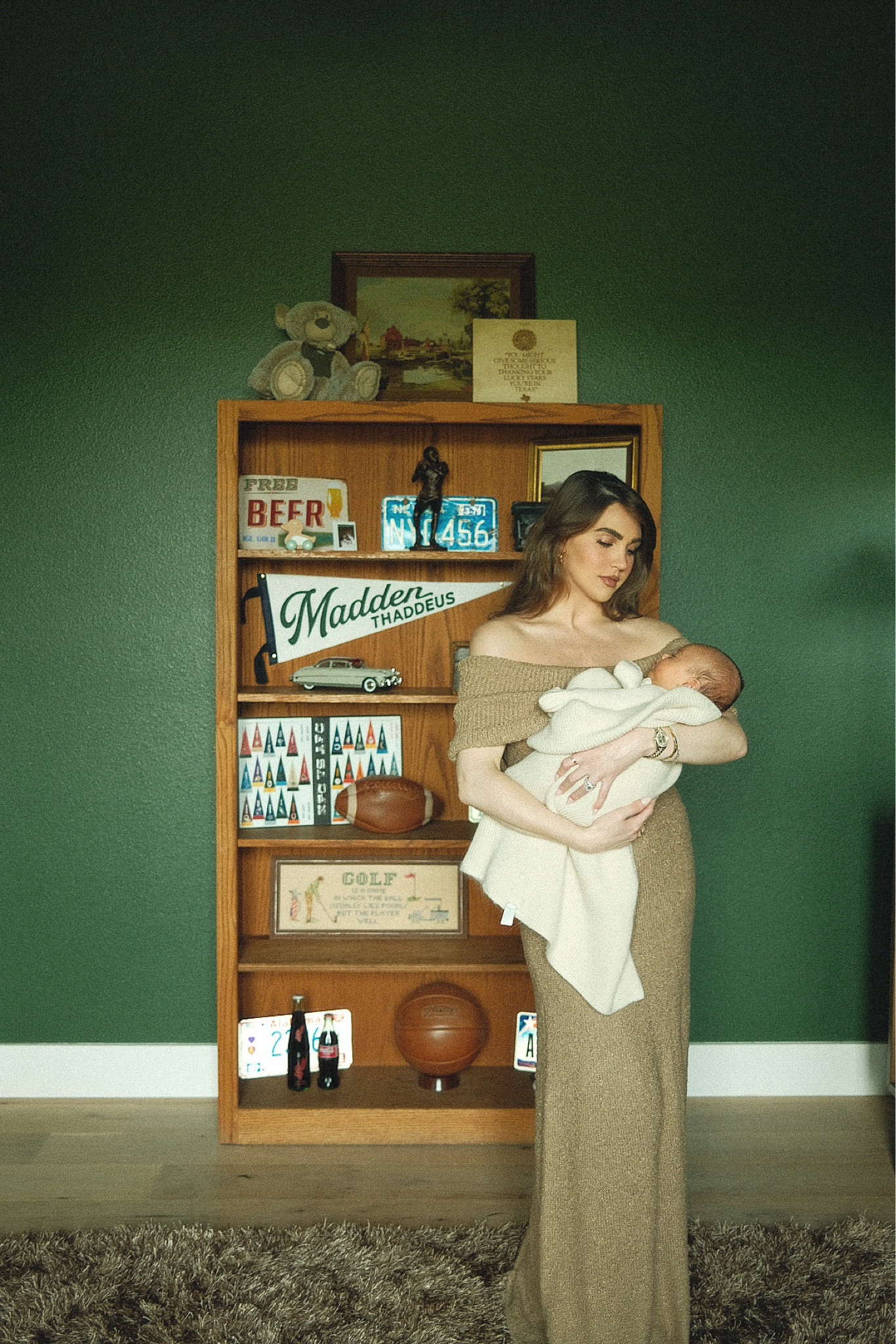 dress is revolve, blanket is from Nordstrom , similar bookshelf linked, balls were from etsy, everything else thrifted 🏈💚