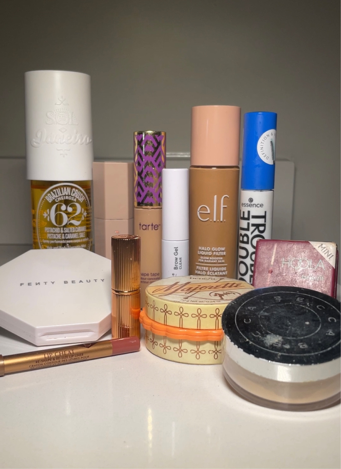 My going out makeup products! 
Sol de Janeiro, perfume, fenty Beauty, highlighter, concealer, tarte shape tape, elf, halo glow, essence, mascara, setting powder, blush, benefit, foundation, lipstick, Charlotte tilbury, lip liner, bronzer, hoola, brow gel, contour, cream, makeup routine, 

#LTKstyletip #LTKbeauty