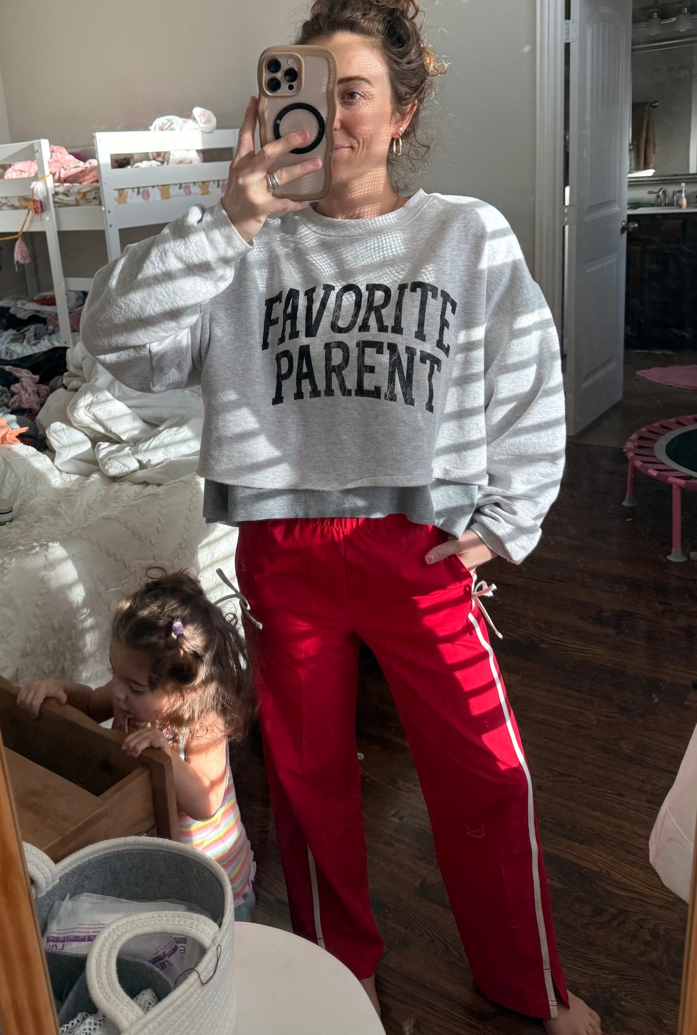 Large in pull over 
Xl In kids track pants or Xs in the women’s 