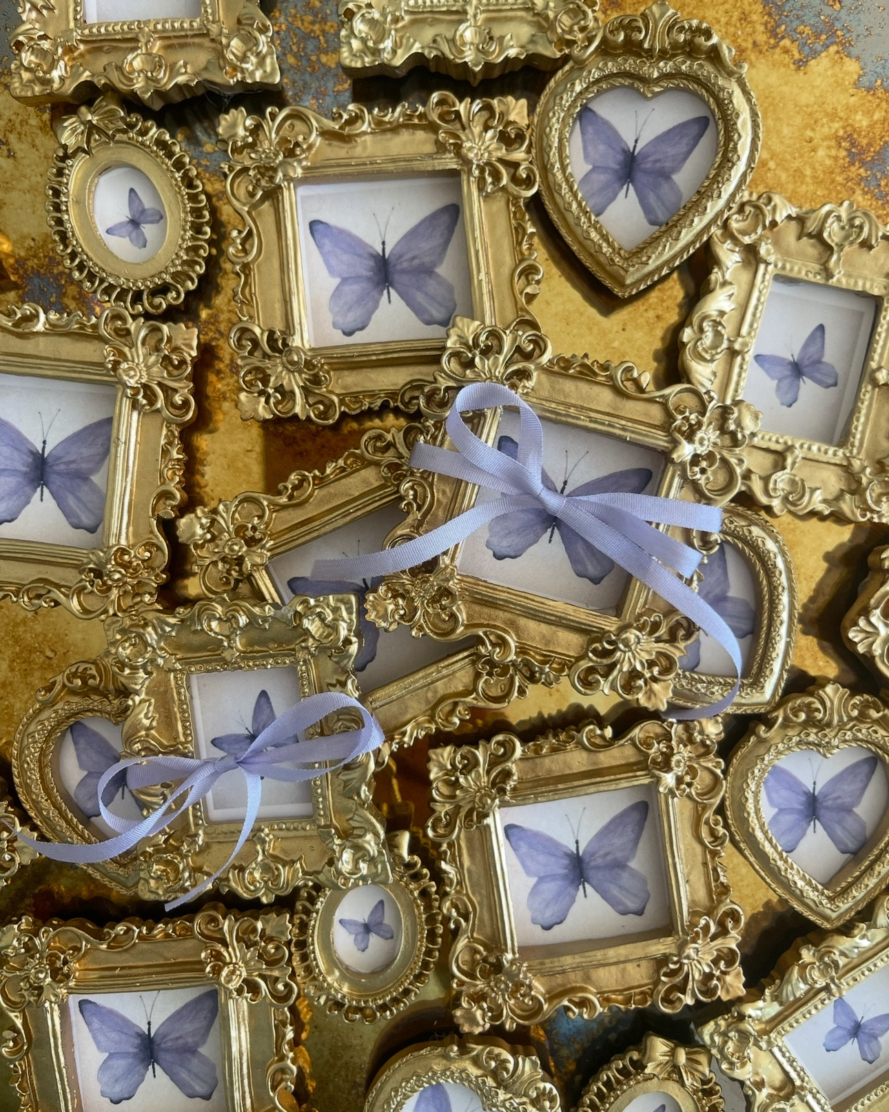 MINI ORNATE GOLD FRAMES 
use as magnets  or add ribbon to hang 
*great idea for a favor for any event 
and just shrink down the image you want 

These frames are very tiny and fit in palm of your hand… and also if you don’t like the gold color- I sprayed mine! Easy peasy! 

I did these with my good friend for a young women’s church event… and they were such a hit! I display mine as n my fridge, magnet board or my washer… and I keep moving it around. 🦋