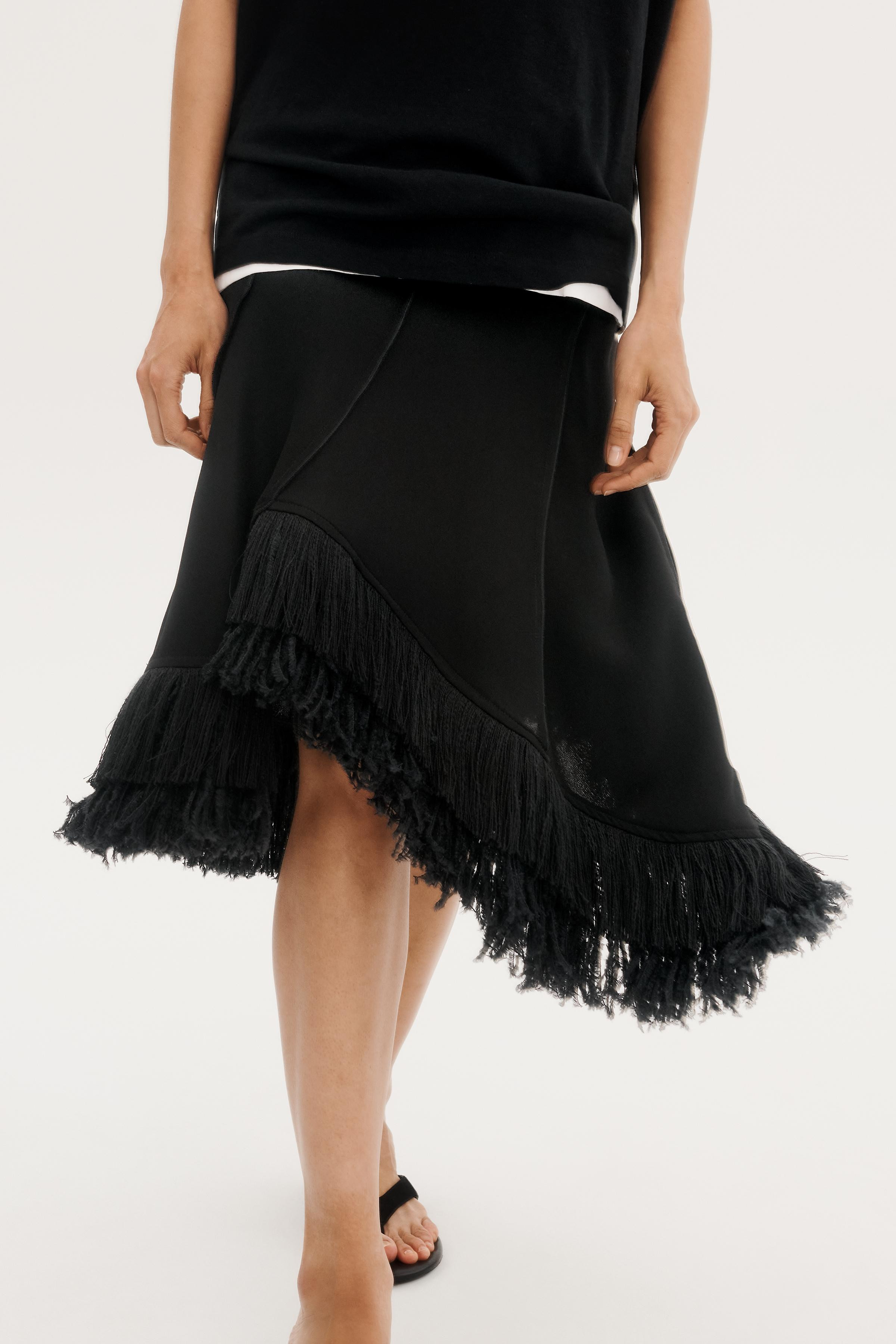 ZARA WOMAN COLLECTIONMid-rise midi skirt with main fabric made from a viscose blend yarn. Asymmet... | Zara US