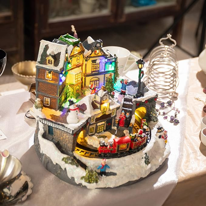 Afirst Christmas Village Houses Collectible Figurines Moving Trains Rotating Xmas Tree Lighted Ch... | Amazon (US)