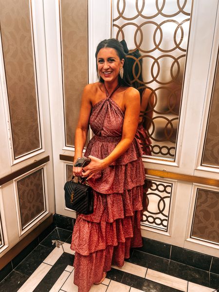 A wedding guest dress, vacation outfit - think resort wear, baby shower or date night outfit - definitely a special occasion dress. This shimmer dark fuchsia maxi has a ruffled skirt, low back and halter tie. Paired with my favorite luxury bag and sparkly earrings, happy spring!
.
.
.
.
.
#buddylove #ysl #maxidress #weddingguest #cocktaildress #vacationoutfit #resortwear 
#LTKSpringSale 

Follow my shop @CourtneyGarrison on the @shop.LTK app to shop this post and get my exclusive app-only content!

#liketkit #LTKSeasonal #LTKparties


#LTKparties #LTKshoecrush #LTKwedding