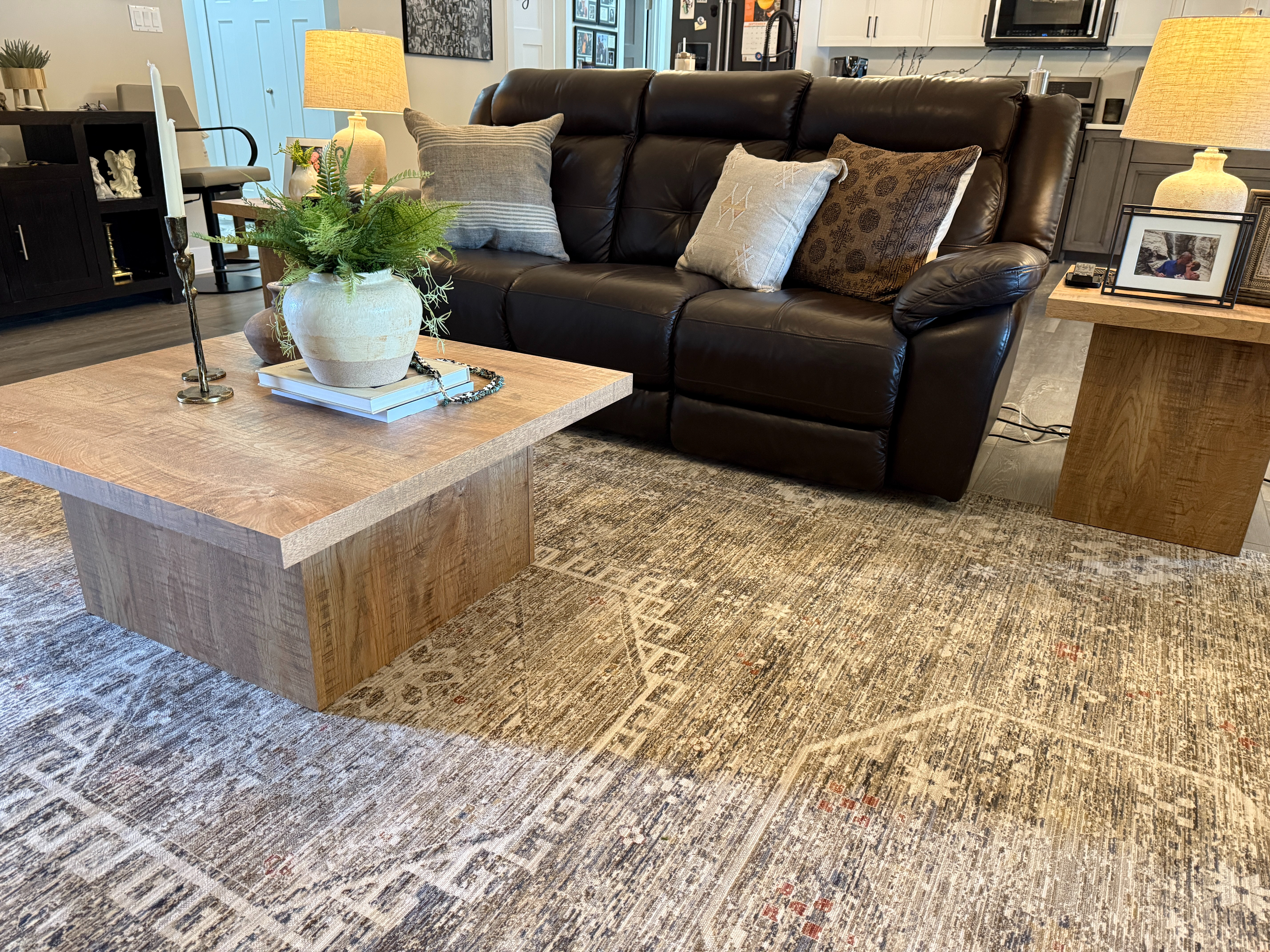 This living room design was a little outside the style we typically gravitate towards, but our clients spend a lot of time in Arizona and are drawn to the textures, tones, and warmth of the desert. With that in mind, we infused the space with subtle Southwest influence, without going full theme.

Using their existing couch, we brought in a new coffee table, side tables, and accessories to create an entirely new look without a complete overhaul.  

 #LTKHome #LTKSaleAlert #LTKStyleTip