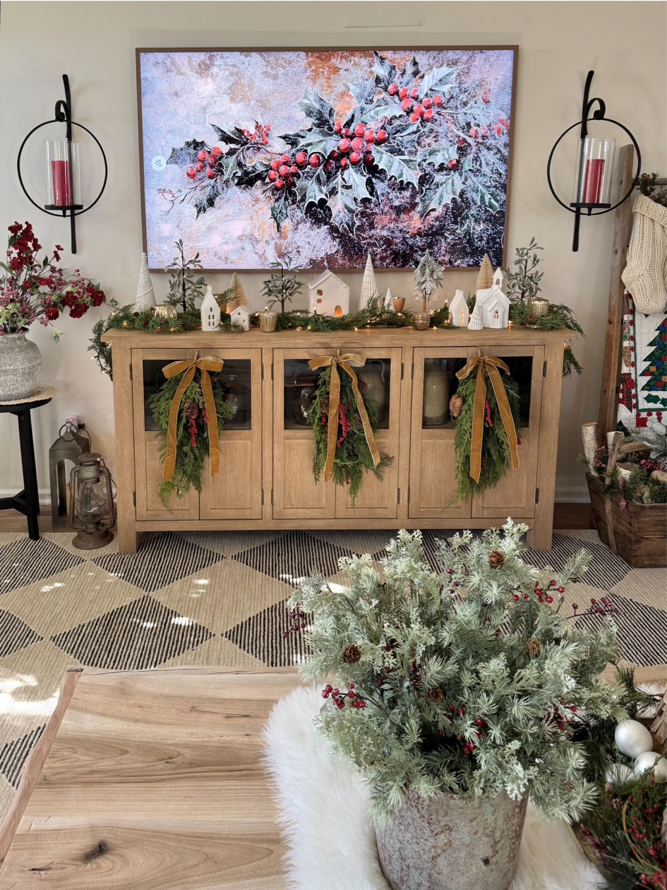My favorite Christmas swags with velvet ribbon. Will sell out quick! Pretty candle wall sconces. Christmas village with white houses and trees. White faux fur table throw. Christmas stems with berries. Seadrift tv stand/buffet. 

#LTKHoliday #LTKSeasonal #LTKHome