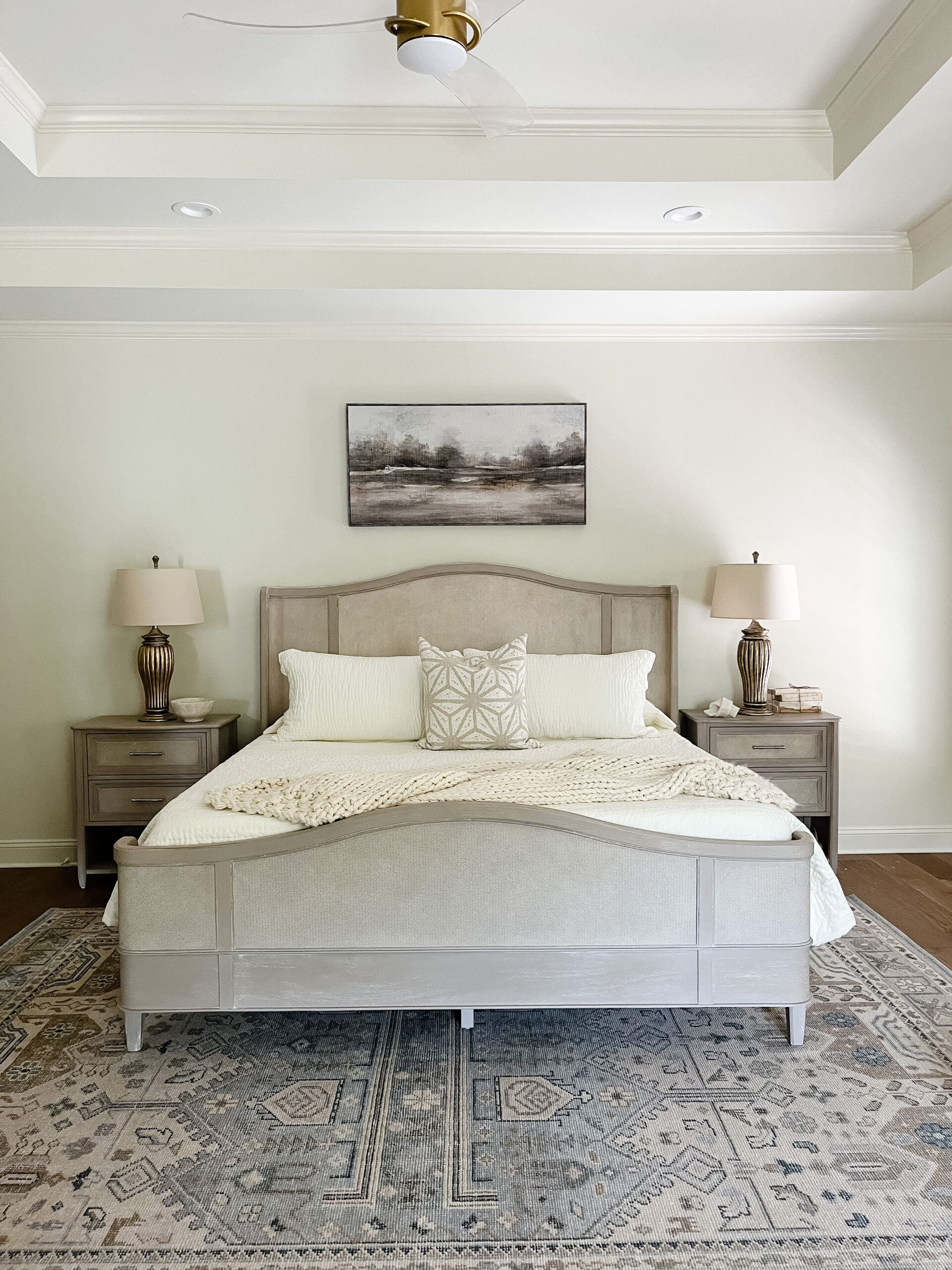 Soft layers, warm tones, and comfort in every detail 🤍 This primary bedroom was designed to feel calm and inviting with cozy textures, linen bedding, a chunky knit throw, and a plush rug underfoot. Warm paint and thoughtful lighting create a serene glow, while an elegant acrylic fan adds a subtle, modern touch. A space made for slowing down. Shop a similar bedroom look below ✨

#ltkhome #bedroomdesign #primarybedroom #cozyhome #neutralbedroom #layeredliving #warmminimalism #interiorinspo #serenespaces #homedecor 

 #LTKHome