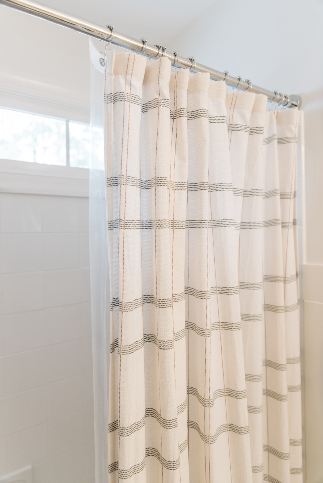 Love this tension shower rod, the shower curtain, and the double hooks that I didn’t even know I’d love this much! There is a hook for the shower curtain and one for the liner.

#LTKFindsUnder50 #LTKHome #LTKFamily