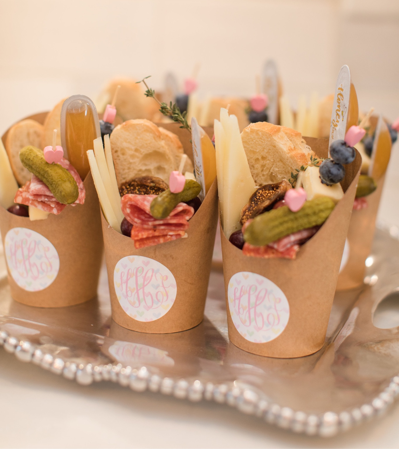 Can’t take credit for the charcuterie cup display, but we sourced the cutest cups honey spoons and heart picks! 


#twosweet #birthday #birthdayparty #hearts #candyhearts #tablescape #placesetting #confetti #sprinkles #floral   #amazon #charcuteriecups