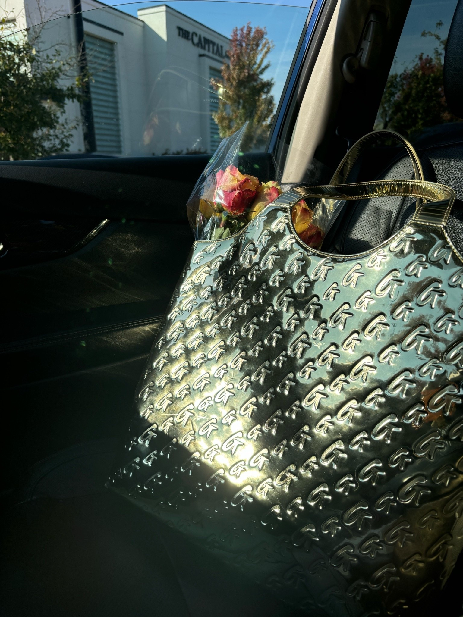 No surprise this maxi tote sold out. 

This metallic gold tote is the perfect mix of statement bag, travel bag, work tote, and everyday carryall without feeling overly flashy.

The kind of oversized tote that instantly makes an outfit feel more elevated while still being practical enough for real life.

Perfect for airport days, weekend trips, errands, work days, mom life, and honestly carrying your whole life around in style.

If you missed this one, don’t worry — I tagged a few other oversized totes and everyday luxury bags that give a similar vibe and are just as good.
