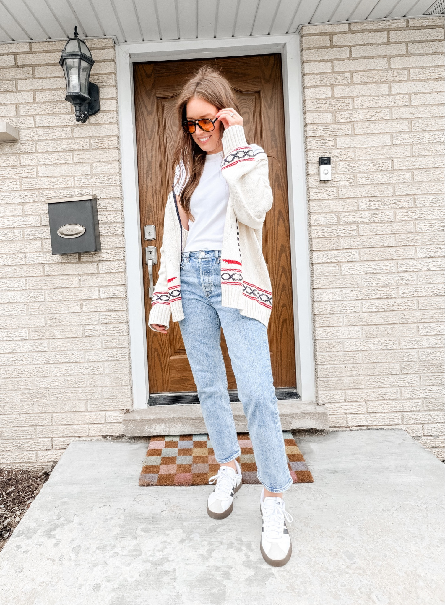 Wearing a M in cardigan - runs tts - size up for a more oversized fit. 

Spring outfit / cardigan / coastal grandmother / jeans / sneakers / sunglasses