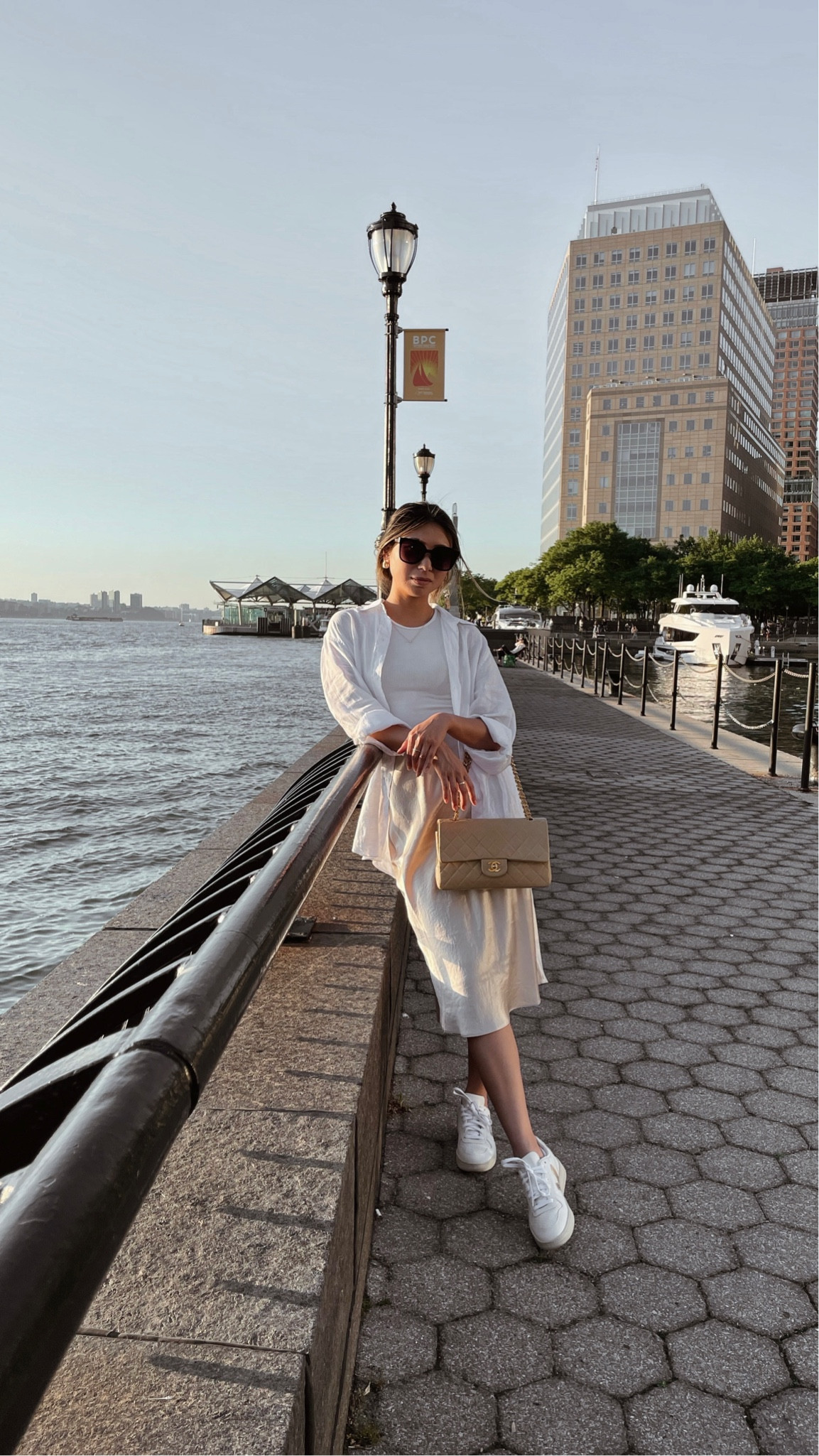 Neutral spring outfit // oversized linen shirt - Zara, cropped high neck ribbed tank - American eagle, satin midi skirt - Aritzia, sneakers - Nike, handbag - Chanel, sunglasses - gentle monster

#LTKstyletip